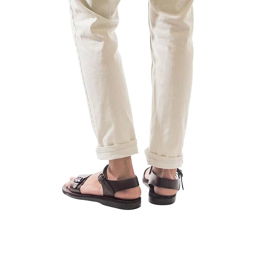 Model wearing The Original brown, handmade leather sandals with back strap 