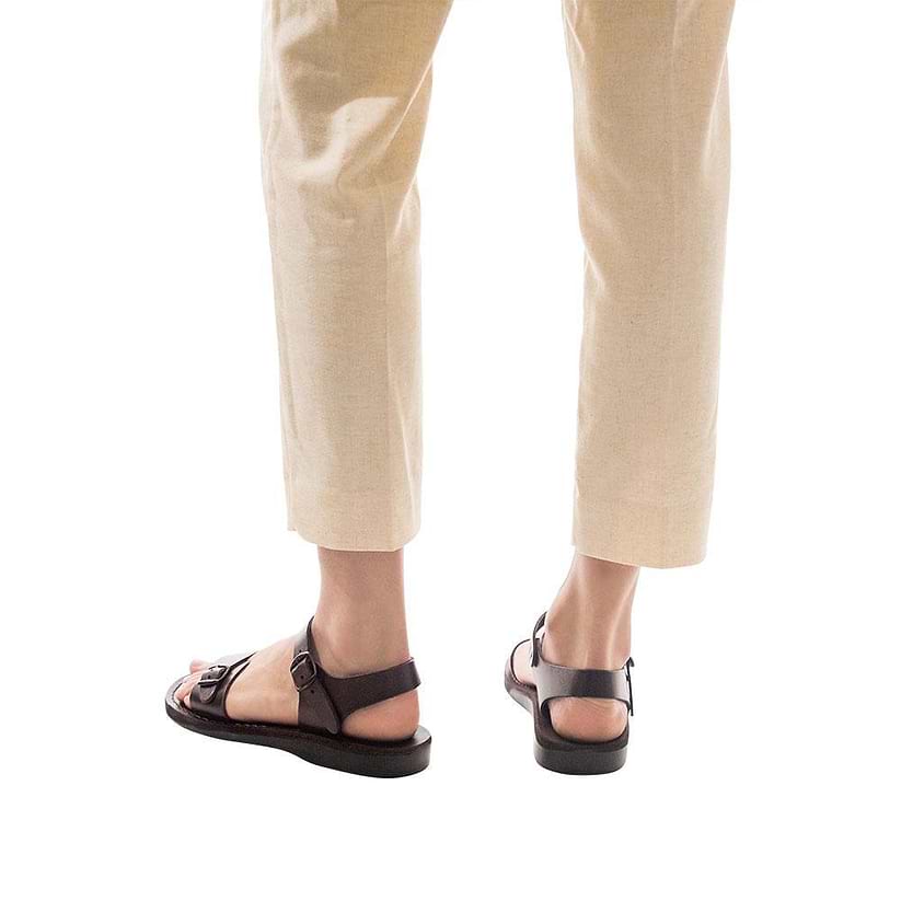 Model wearing The Original brown, handmade leather sandals with back strap 