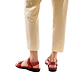Model wearing The Original red, handmade leather sandals with back strap 