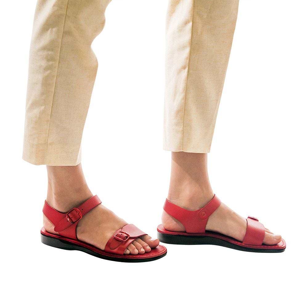 Model wearing The Original red, handmade leather sandals with back strap 