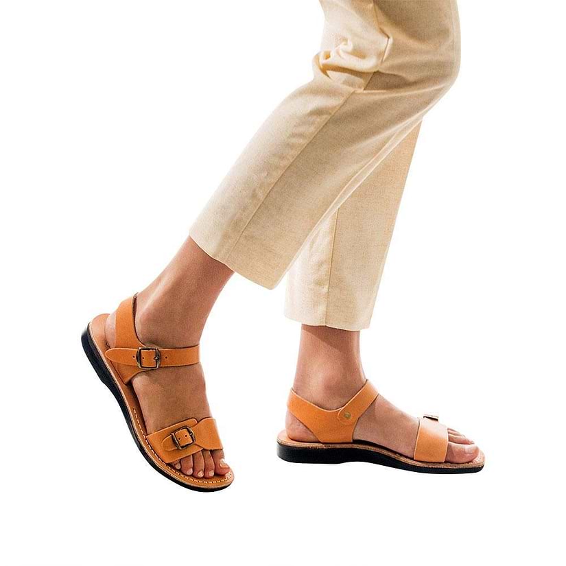 Model wearing The Original tan, handmade leather sandals with back strap 