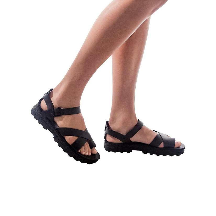 Model wearing Tovah black, handmade leather sandals with back strap and toe loop  - Front View