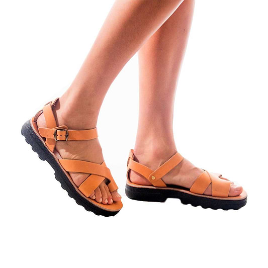Model wearing Tovah tan, handmade leather sandals with back strap and toe loop  