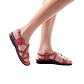 Model wearing Tzippora red, handmade leather sandals with back strap