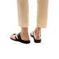 Model wearing Zohar black, handmade leather slide sandals with toe loop
