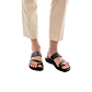 Model wearing Zohar black, handmade leather slide sandals with toe loop