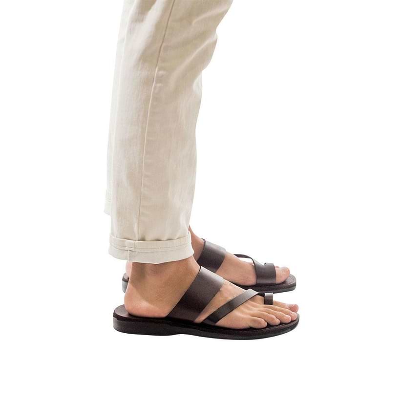 Model wearing Zohar brown, handmade leather slide sandals with toe loop