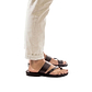 Model wearing Zohar brown, handmade leather slide sandals with toe loop