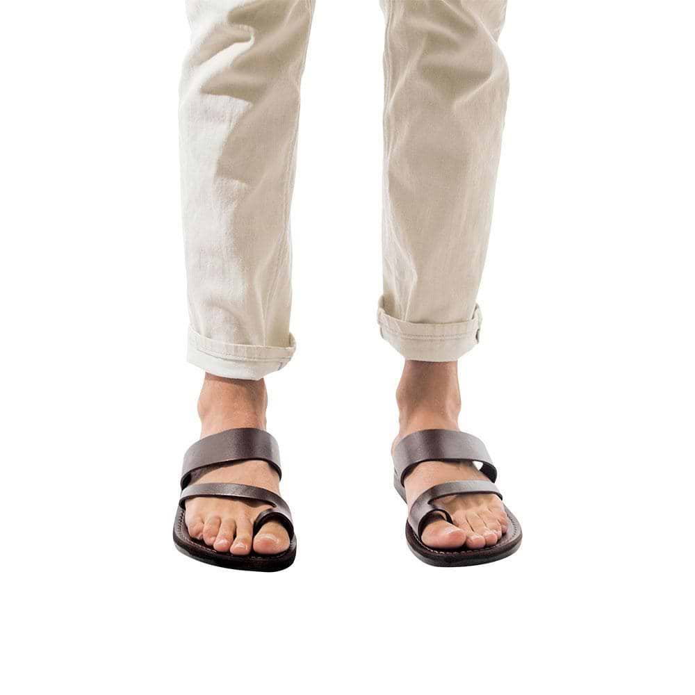 Model wearing Zohar brown, handmade leather slide sandals with toe loop