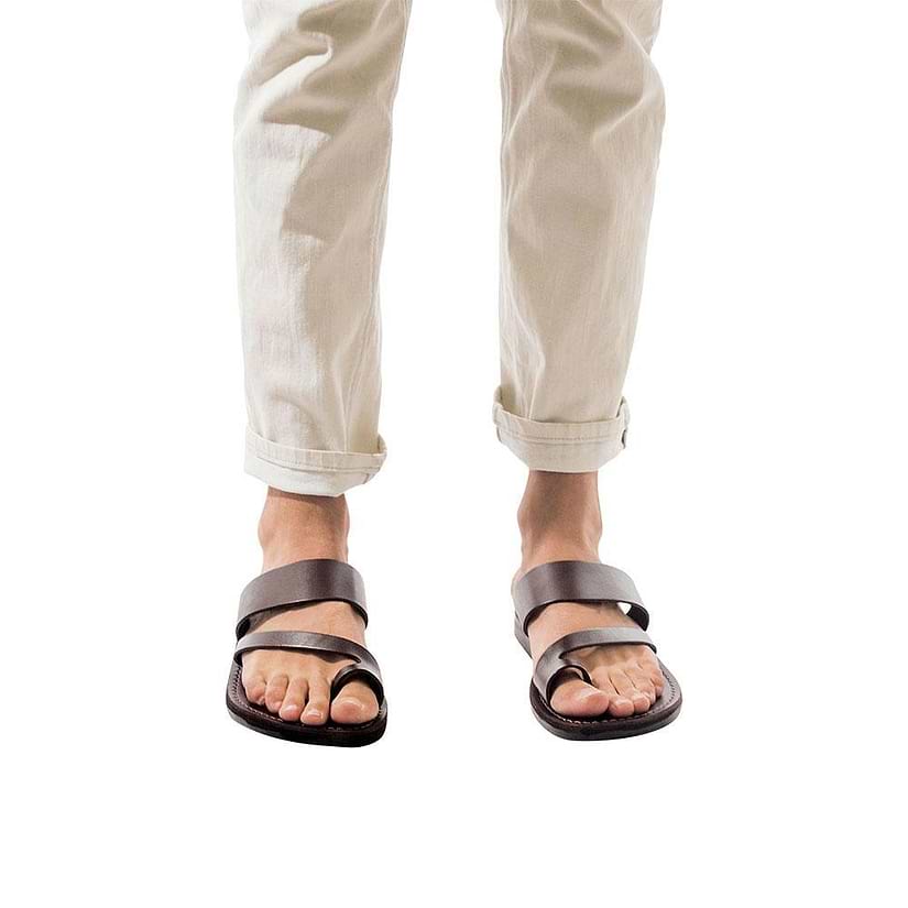 Model wearing Zohar brown, handmade leather slide sandals with toe loop