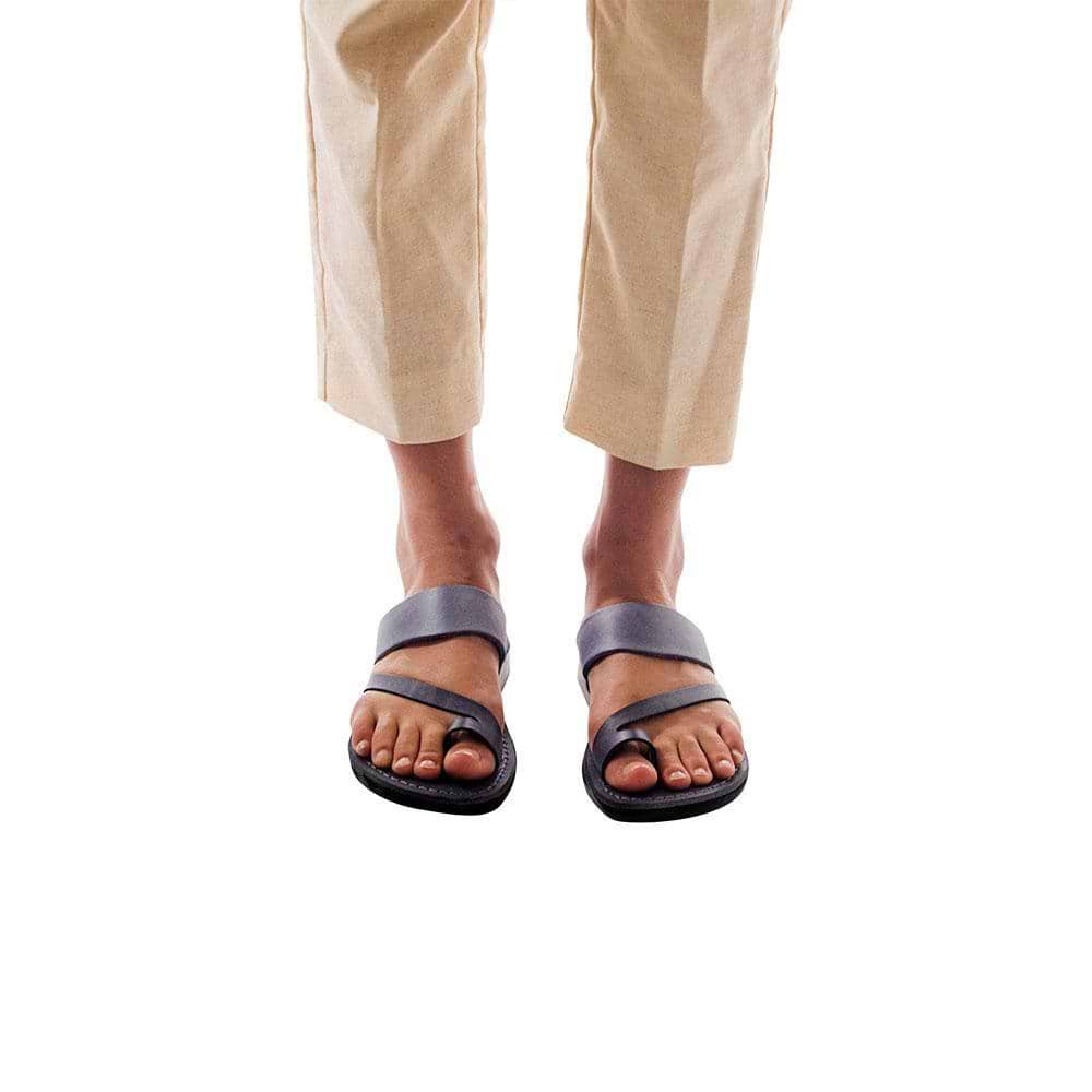 Model wearing Zohar gray, handmade leather slide sandals with toe loop