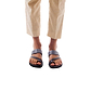 Model wearing Zohar gray, handmade leather slide sandals with toe loop