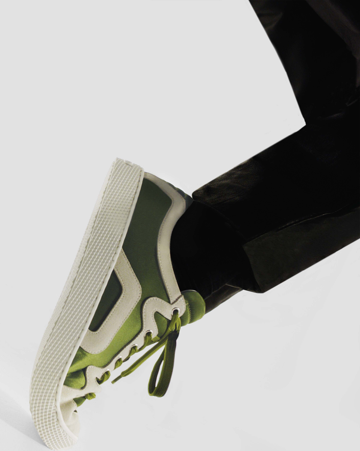 Alpha Sneaker close-up, green colourway, three-quarter view