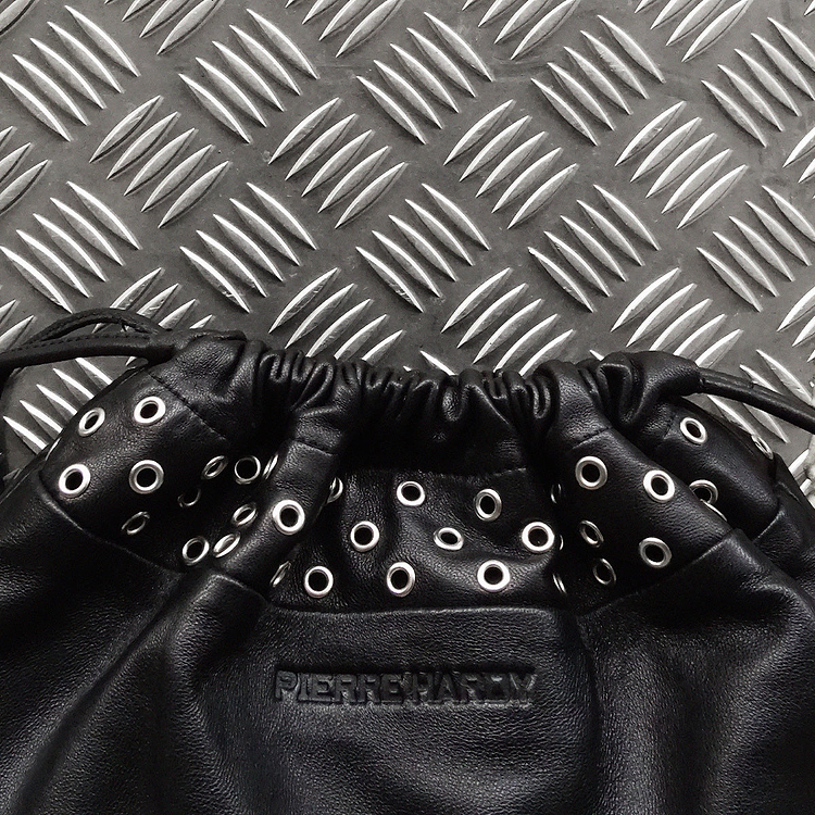 TWIN CLUTCH WITH EYELETS