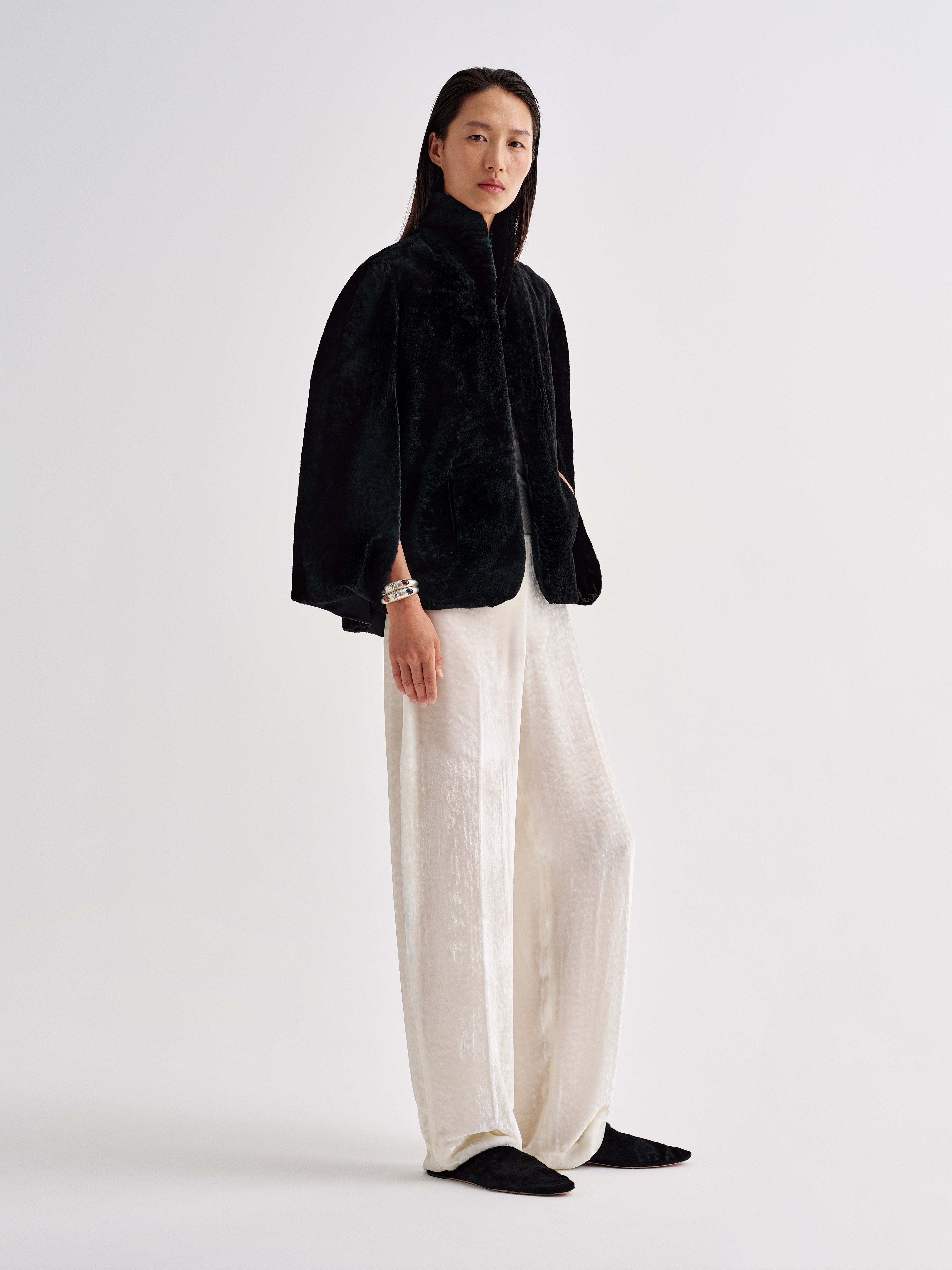 AFLALO Cena Cape in Shearling, Black, side view on model
