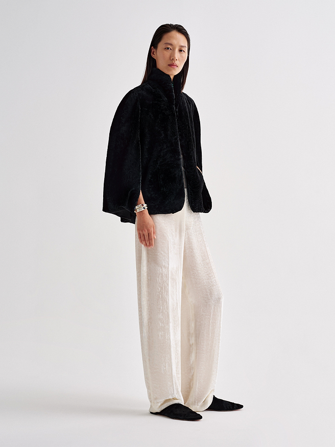 AFLALO Cena Cape in Shearling, Black, side view on model