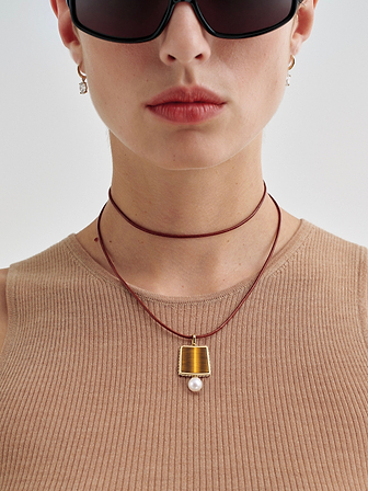 AFLALO Lone Tile Pendant Necklace in Gold, close-up on model