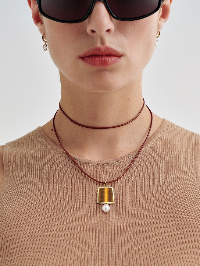 AFLALO Lone Tile Pendant Necklace in Gold, close-up on model