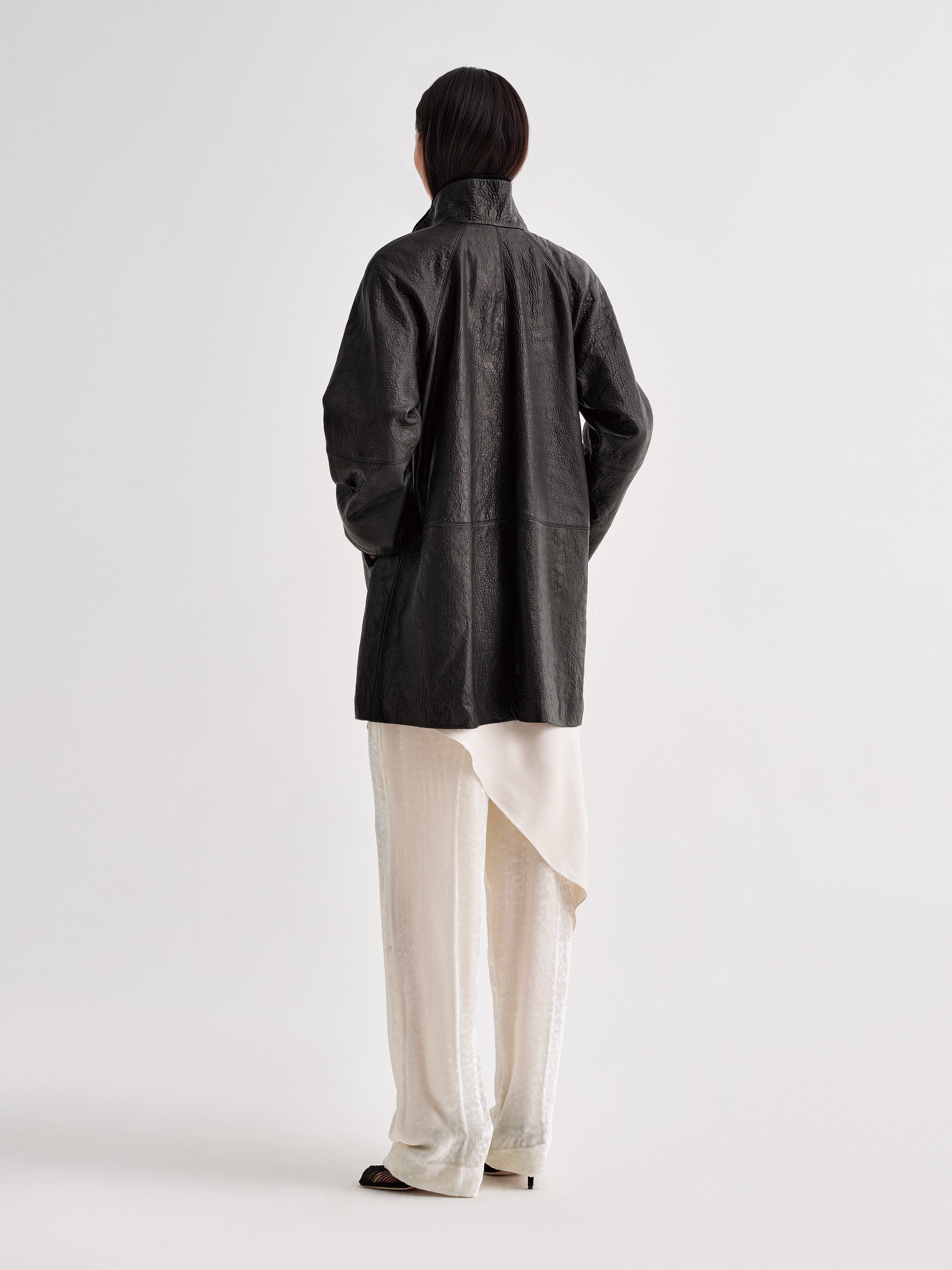 AFLALO Vanta Jacket in Black, back view on model