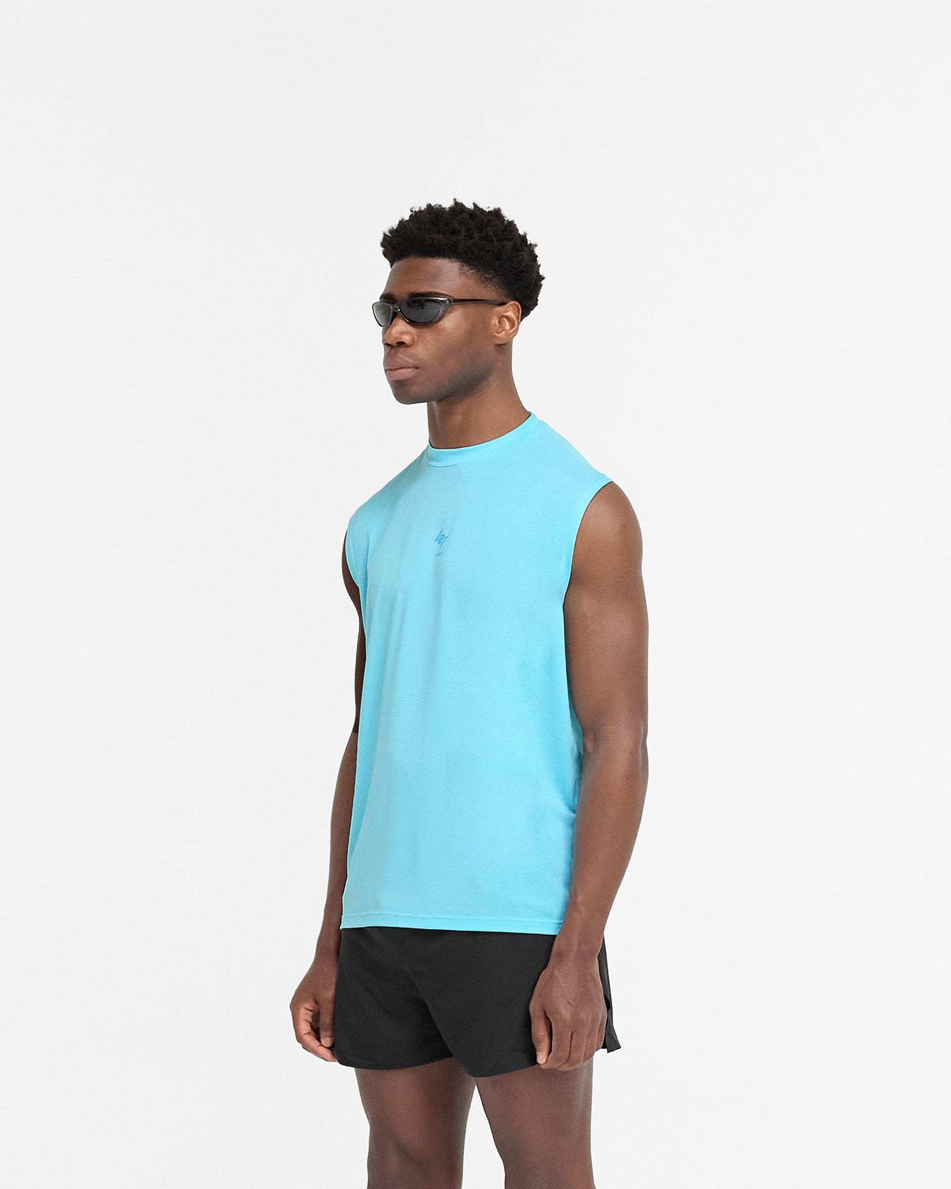 Man wearing an oversized blue tank on a plain white background | 247 Oversized Tank in Ultra Blue | Lightweight breathable tank with 4-way stretch | 247 T-Shirts | Represent Clo