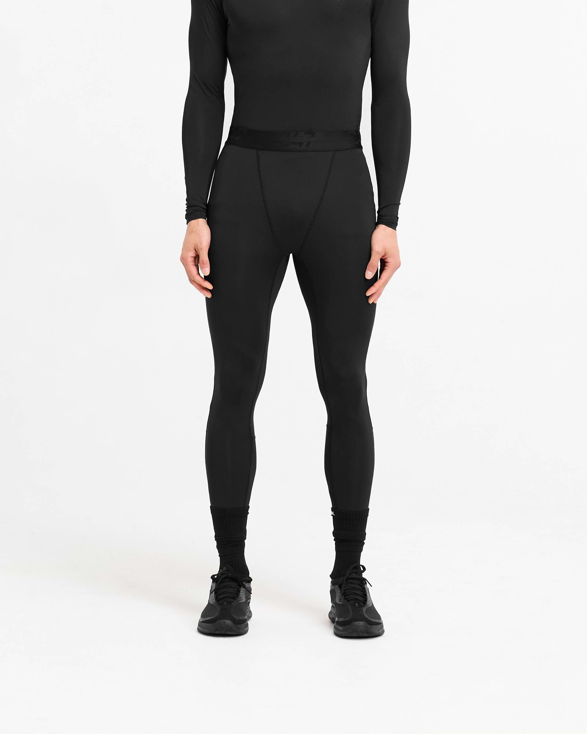 Man wearing black leggings on a plain white background | 247 Compound Legging in Black | Full length leggings with elasticated waistband and fused pocket | 247 Pants | Represent Clo