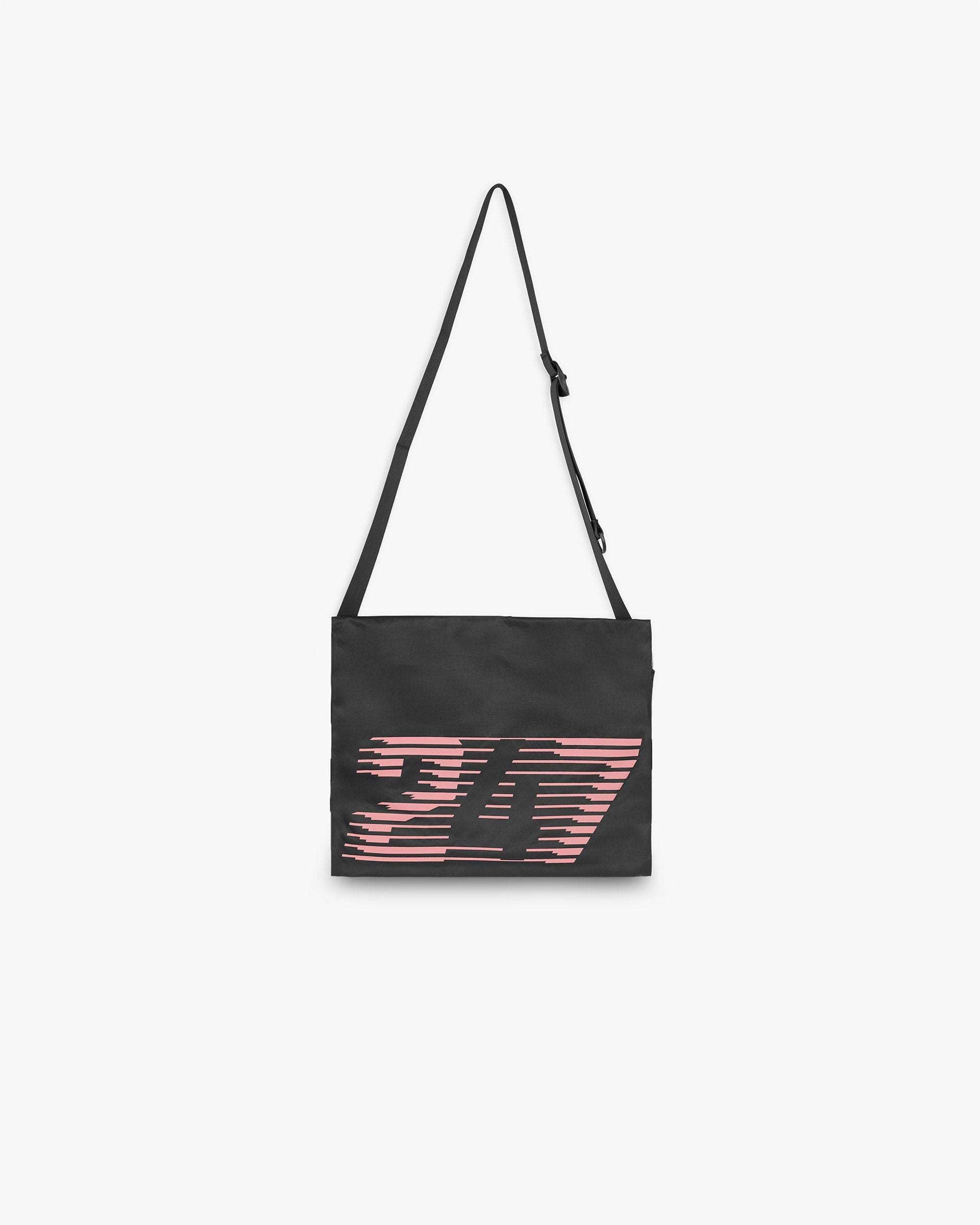 Back product image of a black bag on a plain white background | 247 Los Angeles Bag in Black | Ripstop fabric bag with zippered main compartment | 247 Accessories | Represent Clo