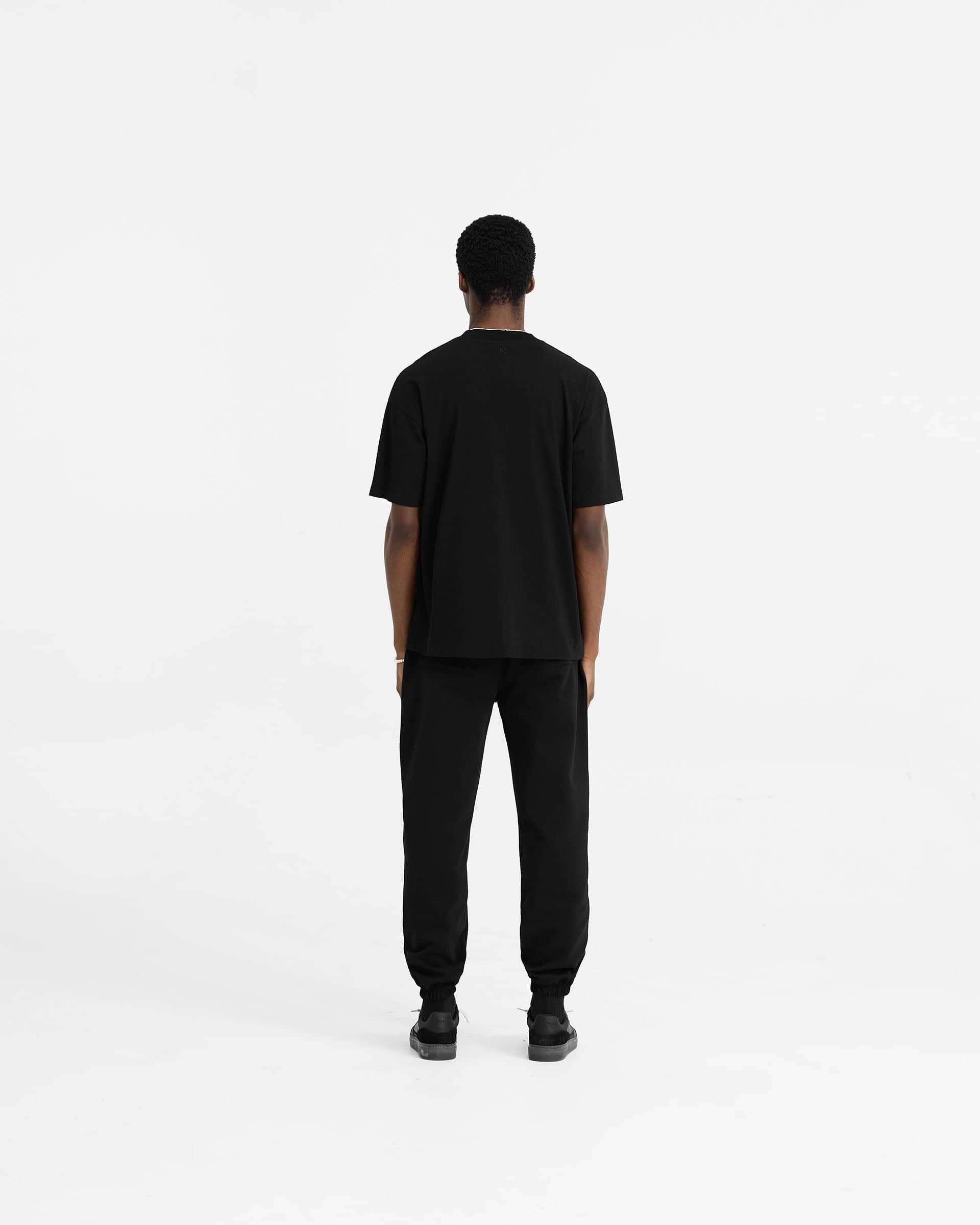 Initial Pantalón de Chándal con Puño - Negro