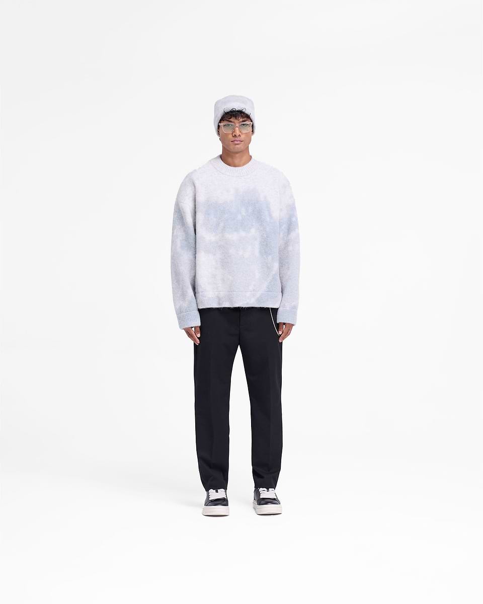 Man wearing an oversized grey knit sweater on a plain white background | Abstract Knit Sweater in Rock | Alpaca wool blend with ribbed cuffs | FW24 Knitwear | Represent Clo