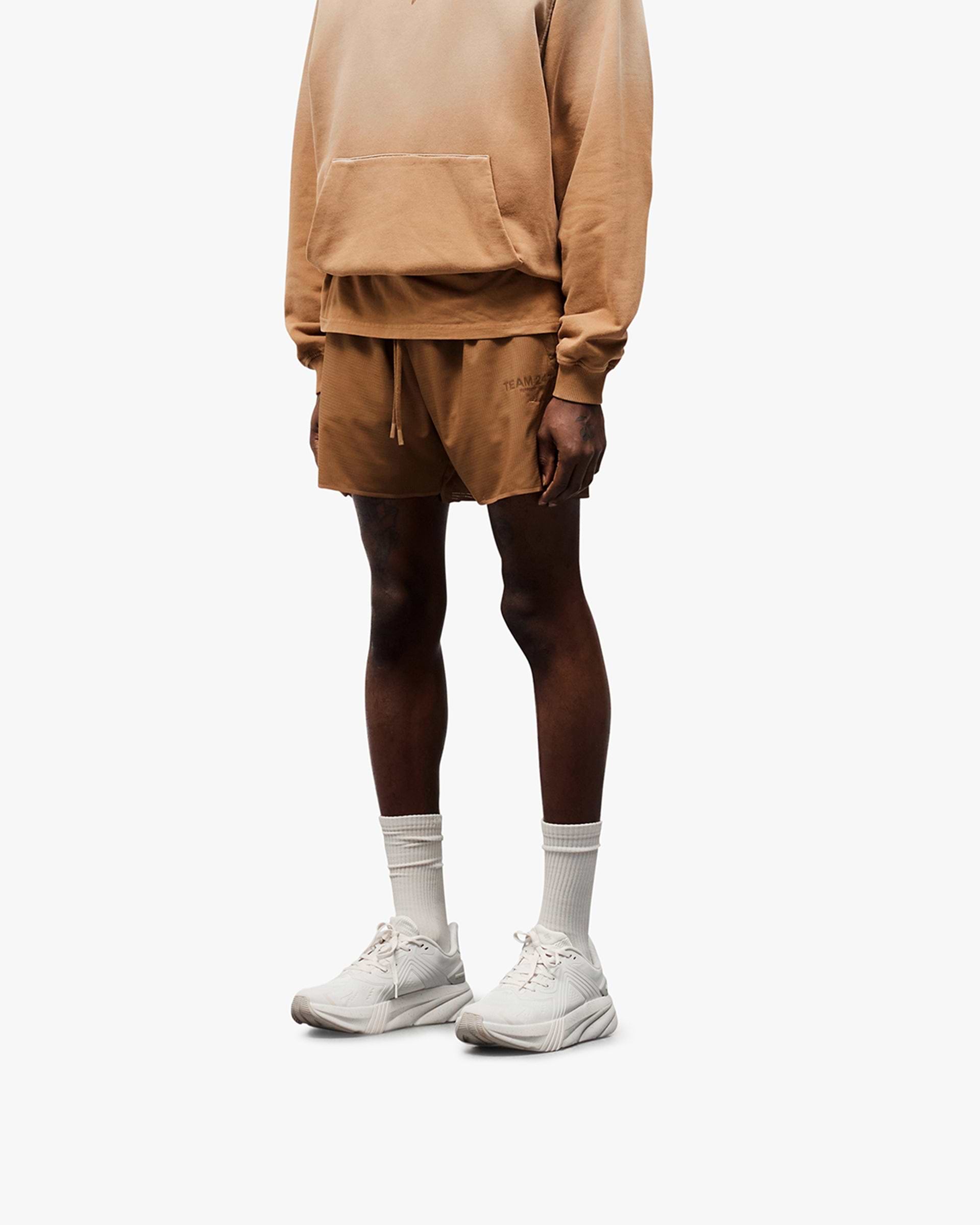 Back product image of mens rust shorts on a plain white background | Team 247 Aero Shorts in Rust | Lightweight running shorts with branded waistband | 247 Shorts | Represent Clo