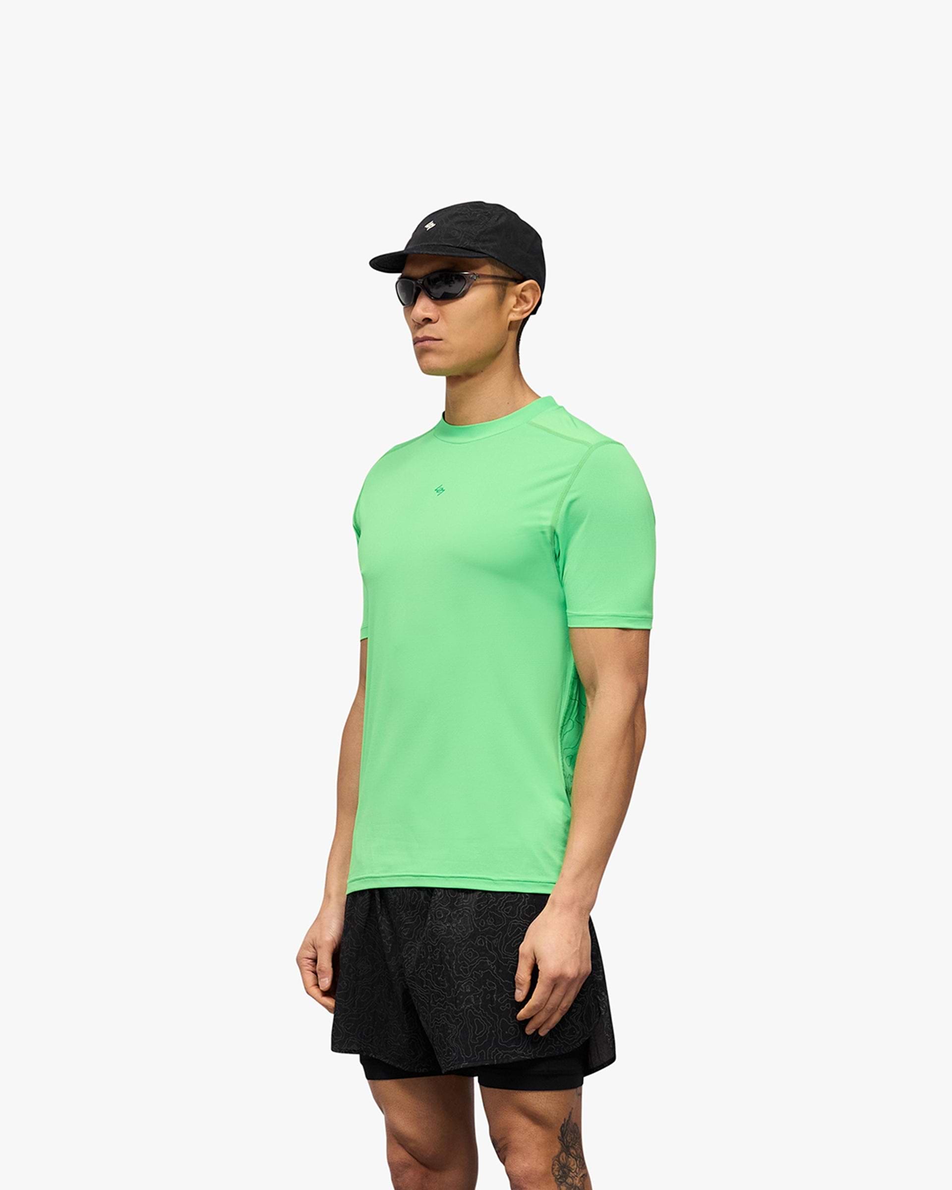Man wearing a green t-shirt on a plain white background | 247 Contour Run T-Shirt in Speed Green | Breathable mesh running t-shirt with antibacterial finish | 247 T-Shirts | Represent Clo