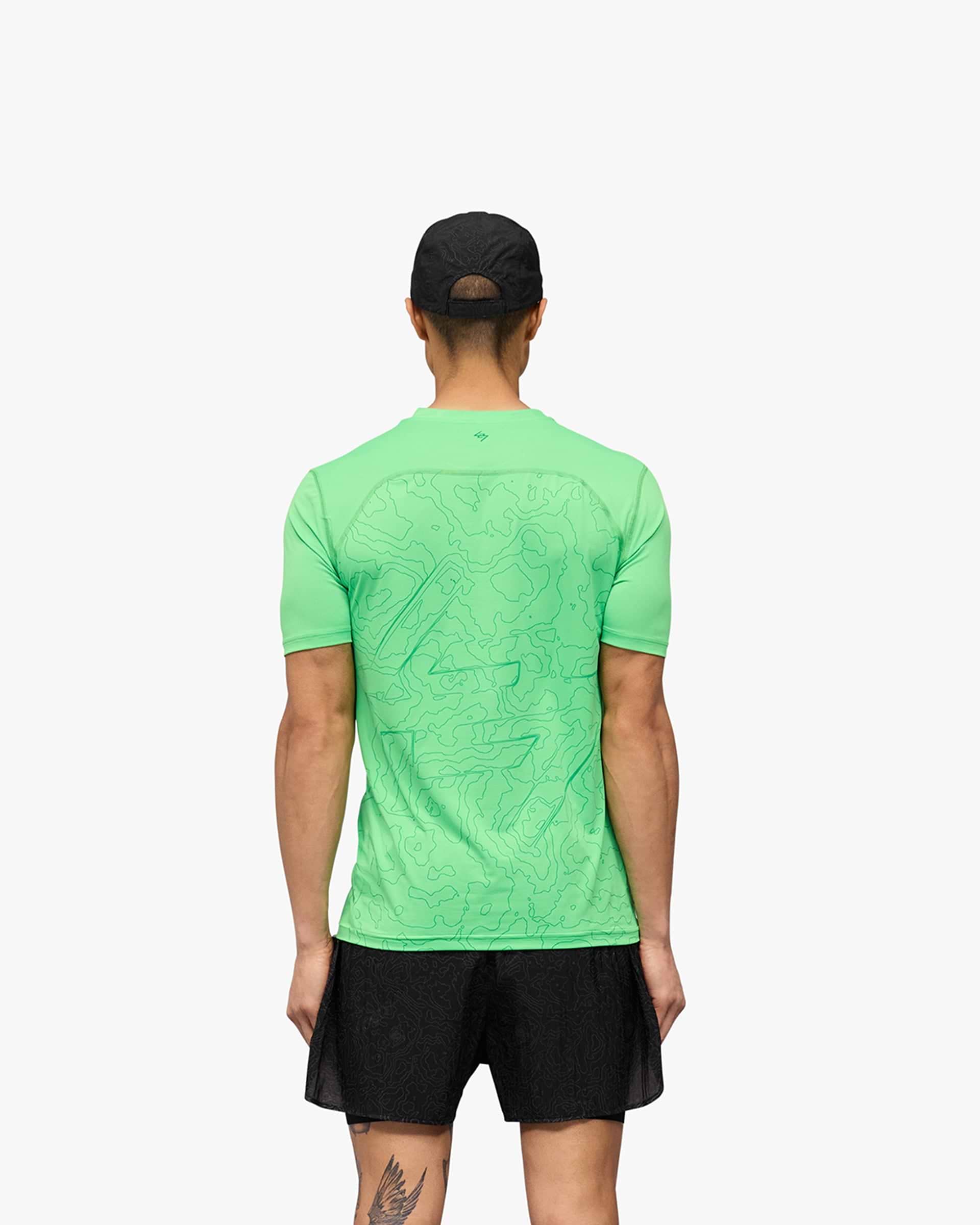 Man wearing a green t-shirt on a plain white background | 247 Contour Run T-Shirt in Speed Green | Breathable running t-shirt with contour back print | 247 T-Shirts | Represent Clo