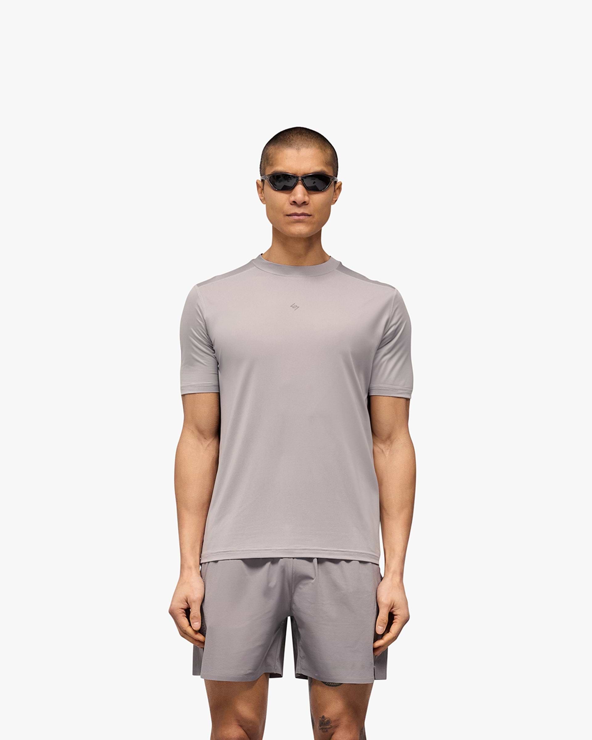 Man wearing a grey running t-shirt on a plain white background | 247 Contour Run T-Shirt in Titanium | Breathable, sweat-wicking running t-shirt | 247 T-Shirts | Represent Clo