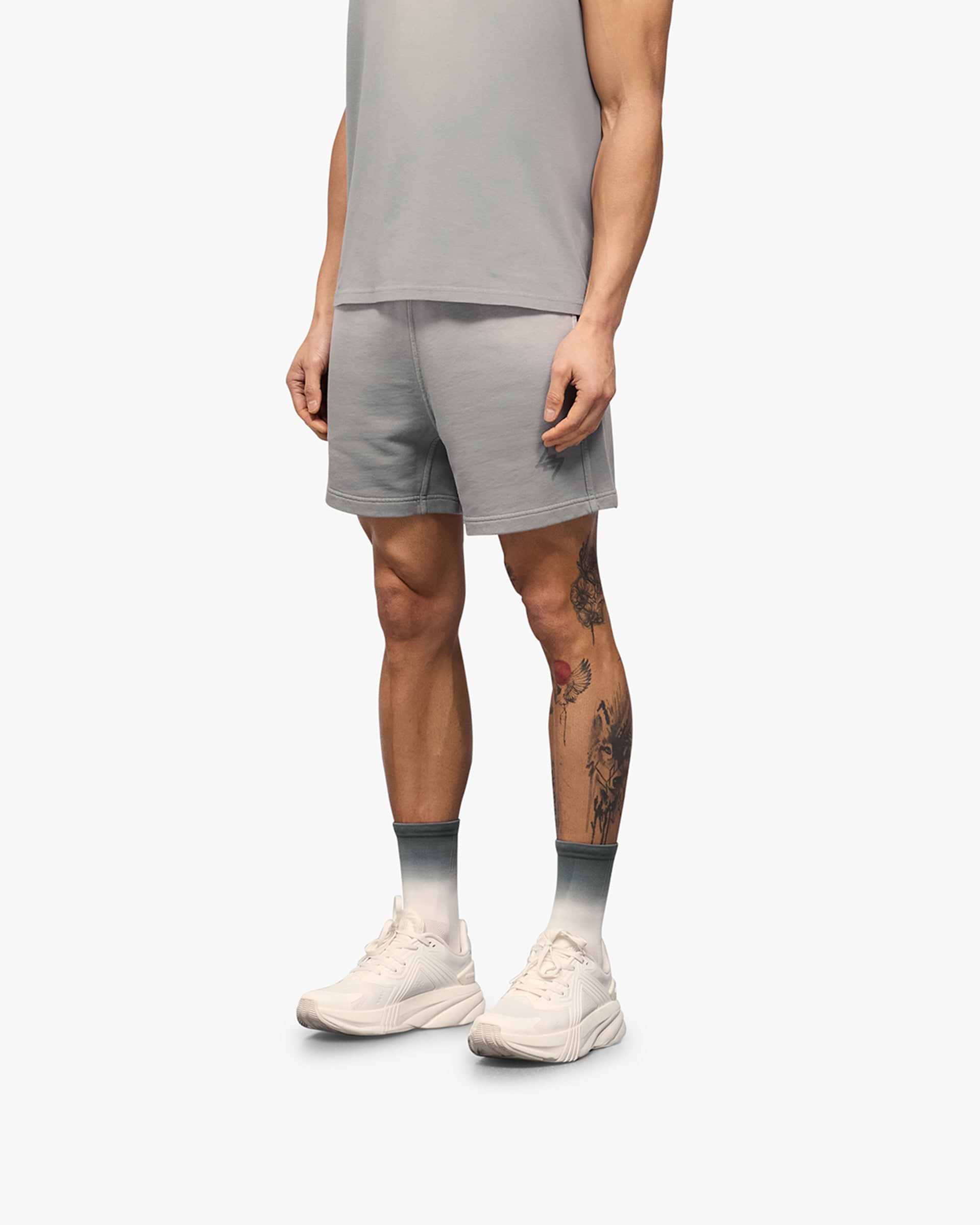 Back product image of mens grey shorts on a plain white background | 247 Motion Shorts in Titanium | Shorts with elasticated waistband and water based graphic print | 247 Shorts | Represent Clo