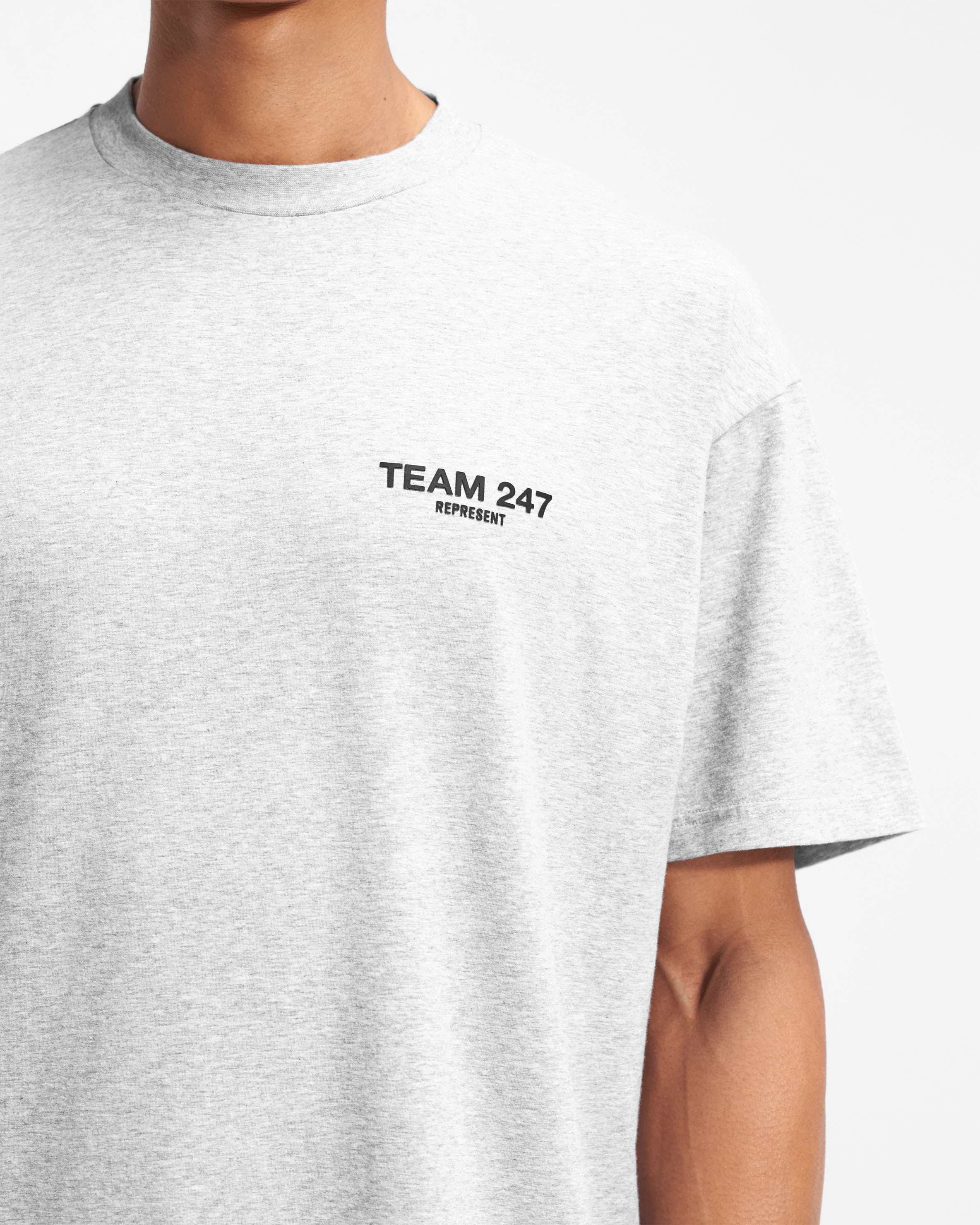 Man wearing a grey oversized t-shirt on a plain white background | Team 247 Oversized T-Shirt in Ash Grey | Gym top with quick dry and breathable fabric | 247 T-Shirts | Represent Clo