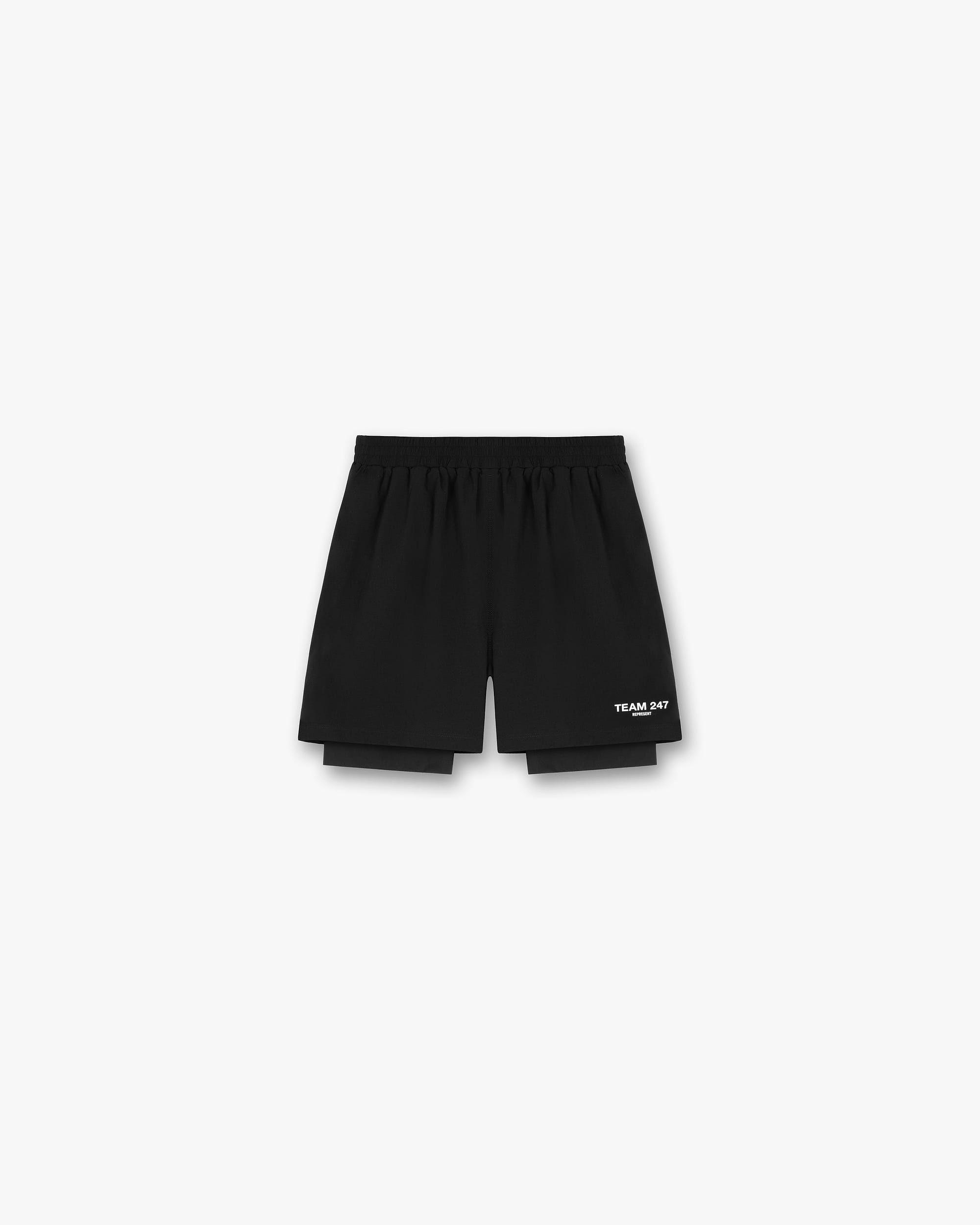 Back product image of mens black shorts on a plain white background | Team 247 2-In-1 Shorts in Black | Shorts with inside leggings and zip pockets | 247 Shorts | Represent Clo