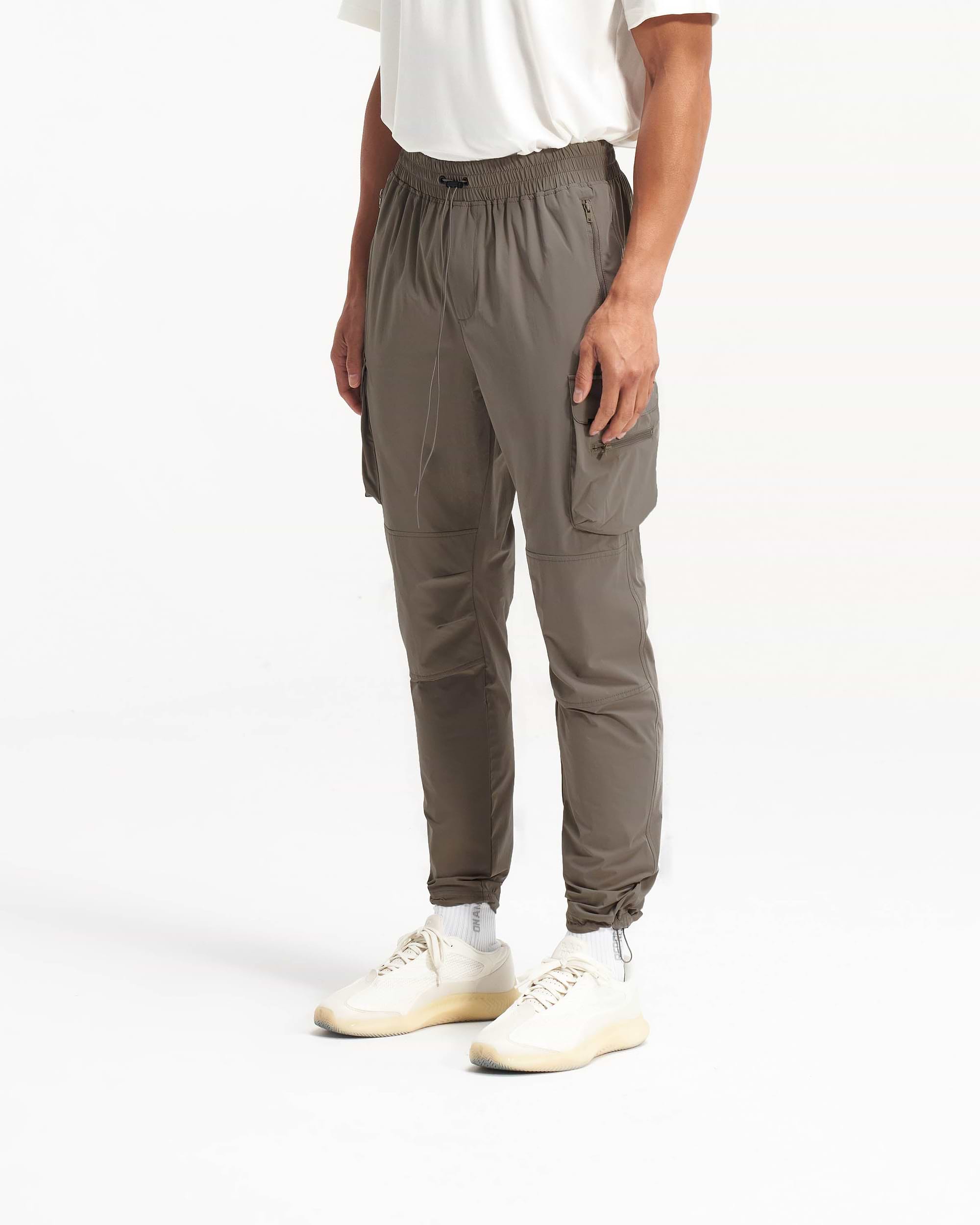 Back product image of mens olive pants on a plain white background | 247 Pant in Olive | Cargo pants with spacious zip side pockets | 247 Pants | Represent Clo