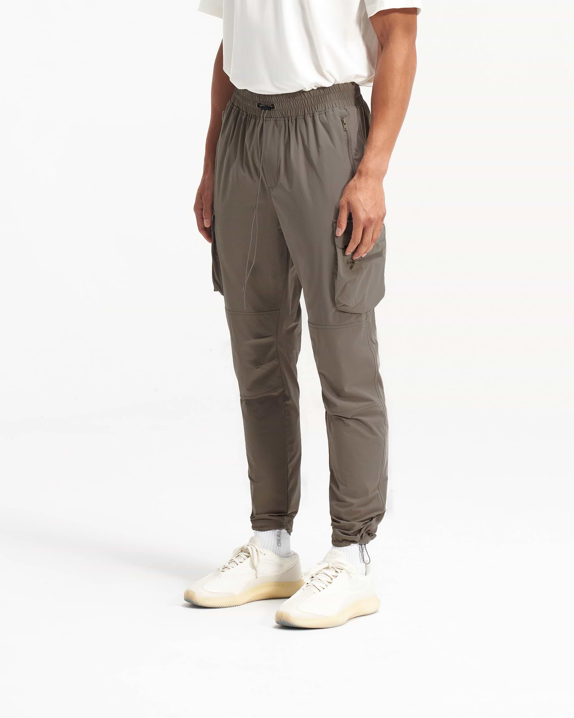 Back product image of mens olive pants on a plain white background | 247 Pant in Olive | Cargo pants with spacious zip side pockets | 247 Pants | Represent Clo
