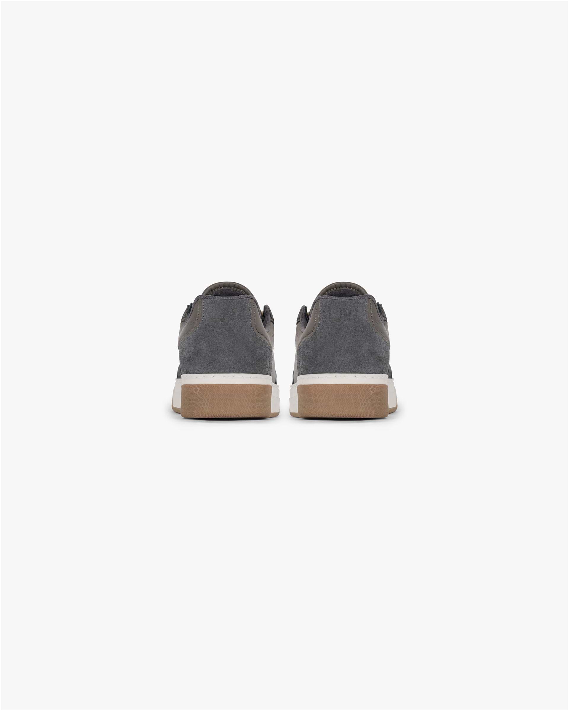 Product shot of a mens dark taupe sneaker on a plain white background | Initial Sneaker in Suede Dark Taupe | Suede and leather footwear with embossed branding | SS25 Footwear | Represent Clo
