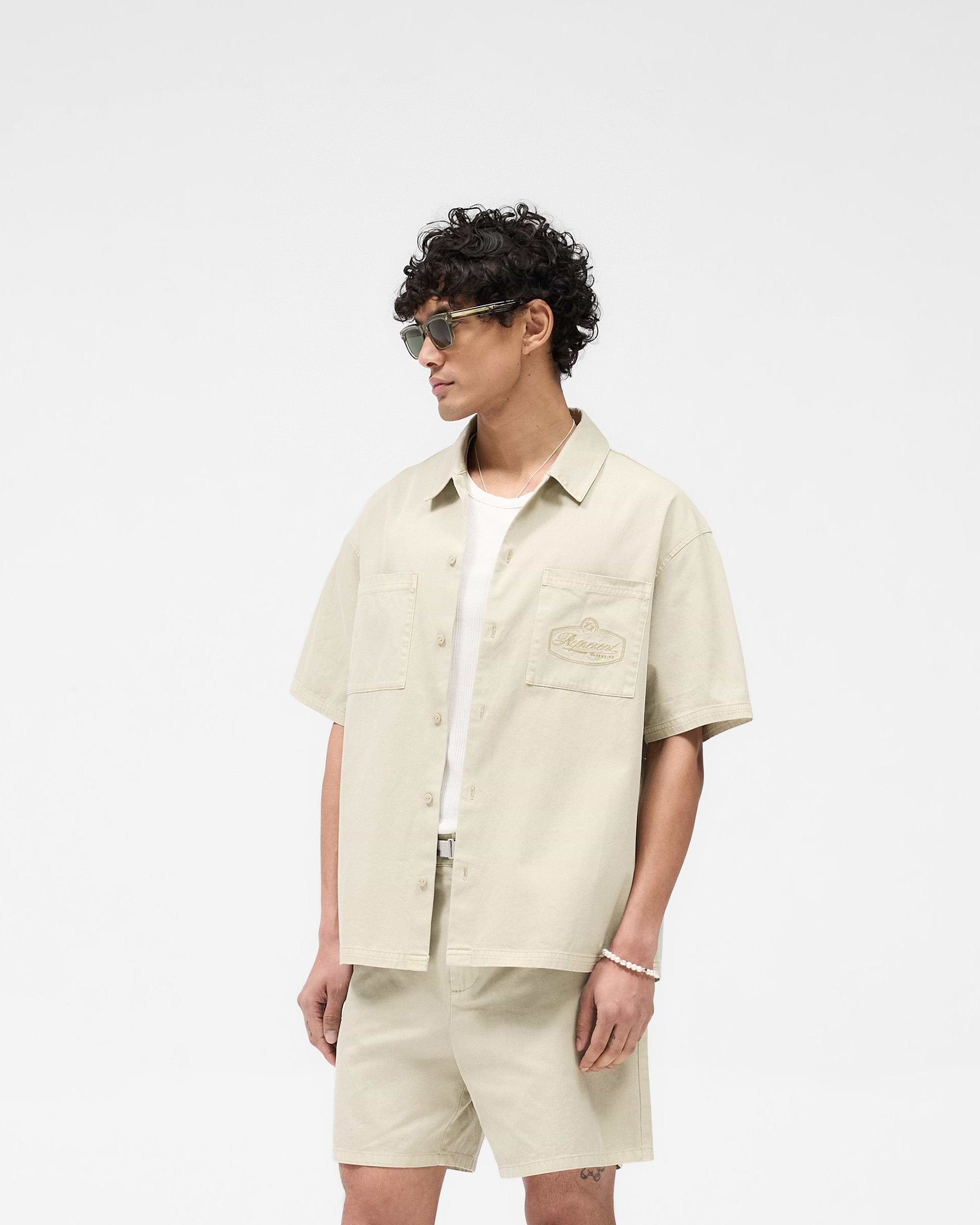 Back product image of a mens beige overshirt on a plain white background | Short Sleeve Cotton Overshirt in Beige | Structured fit cotton shirt | SS25 Shirts | Represent Clo