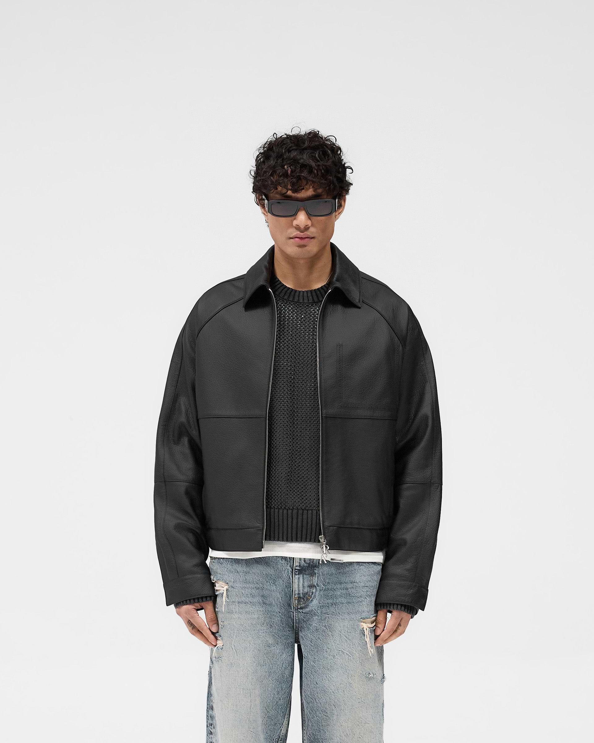 Man wearing a black leather jacket on a plain white background | Overdrive Leather Jacket in Black | Leather jacket with oversized proportions and premium detailing | SS25 Outerwear | Represent Clo
