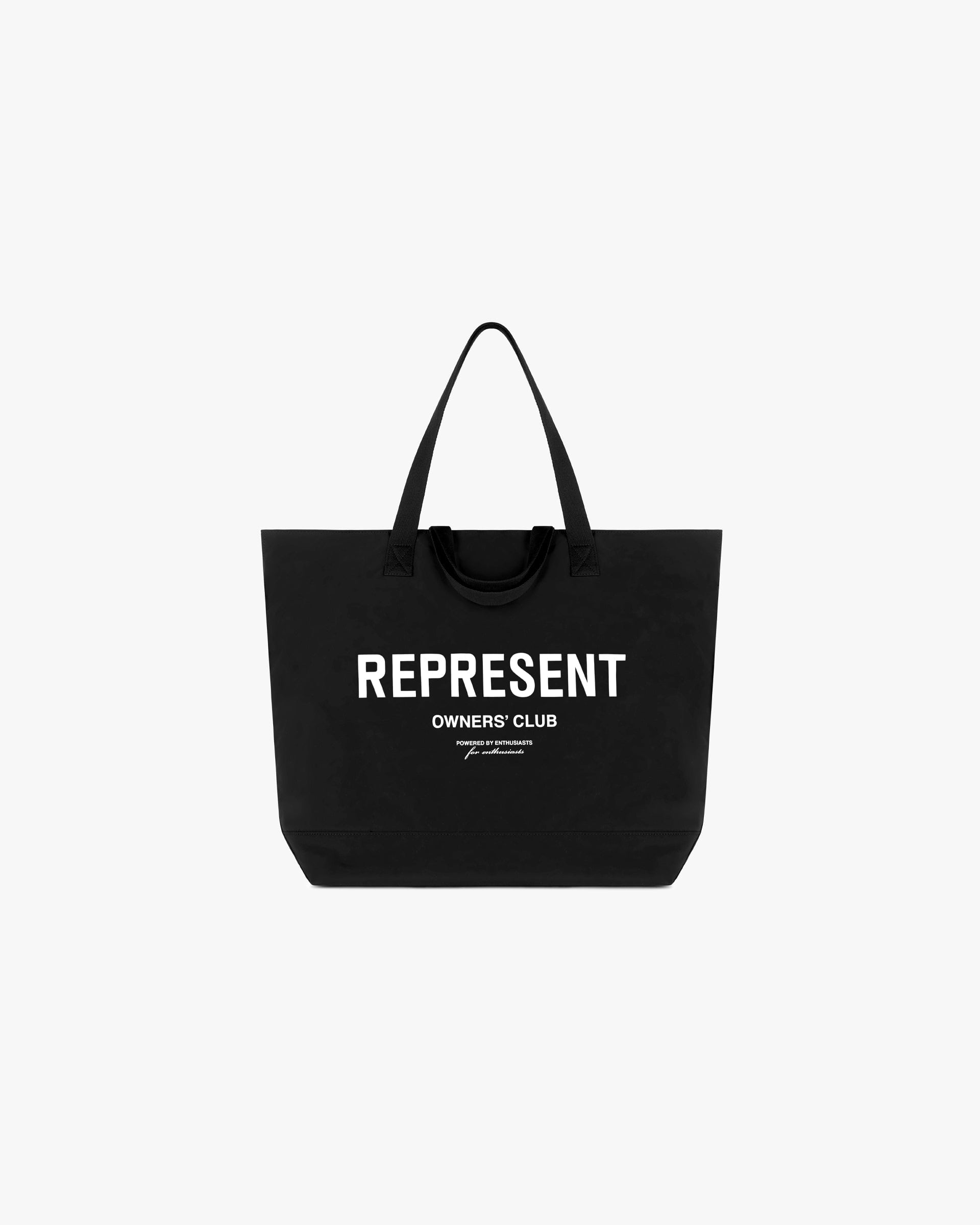 Front product image of a black woven tote bag on a plain white background | Represent Owners Club Woven Tote Bag in Black | Durable accessory with ample storage | Owners Club Accessories | Represent Clo