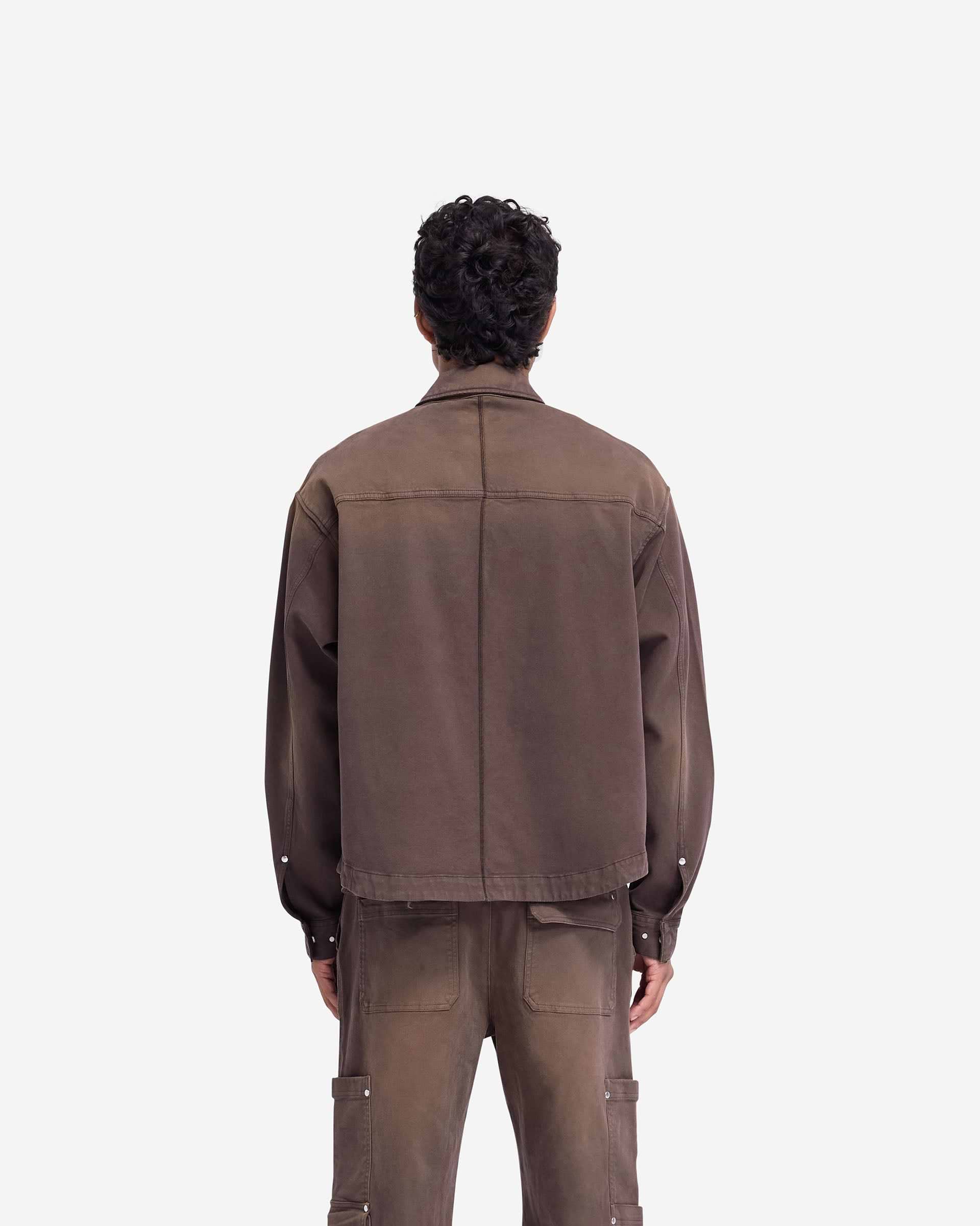 Man wearing a cedar overshirt on a plain white background | Workshop Shirt in Cedar | Everyday overshirt with flap and patch pockets | FW24 Shirts | Represent Clo