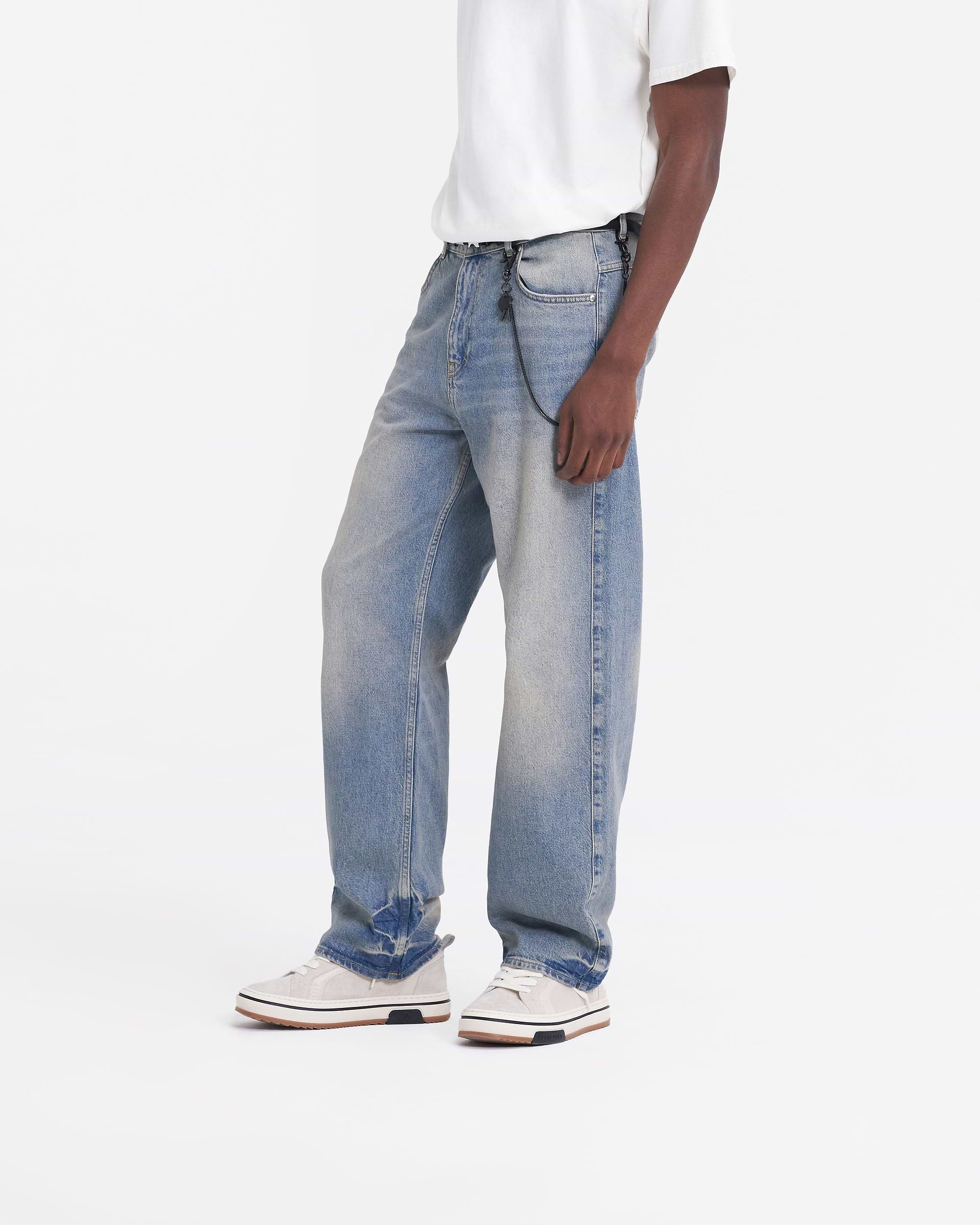 Back product image of mens blue denim jeans on a plain white background | R3 Baggy Denim in Blue | Baggy fit denim with embroidered rear pocket | SS24 Denim | Represent Clo