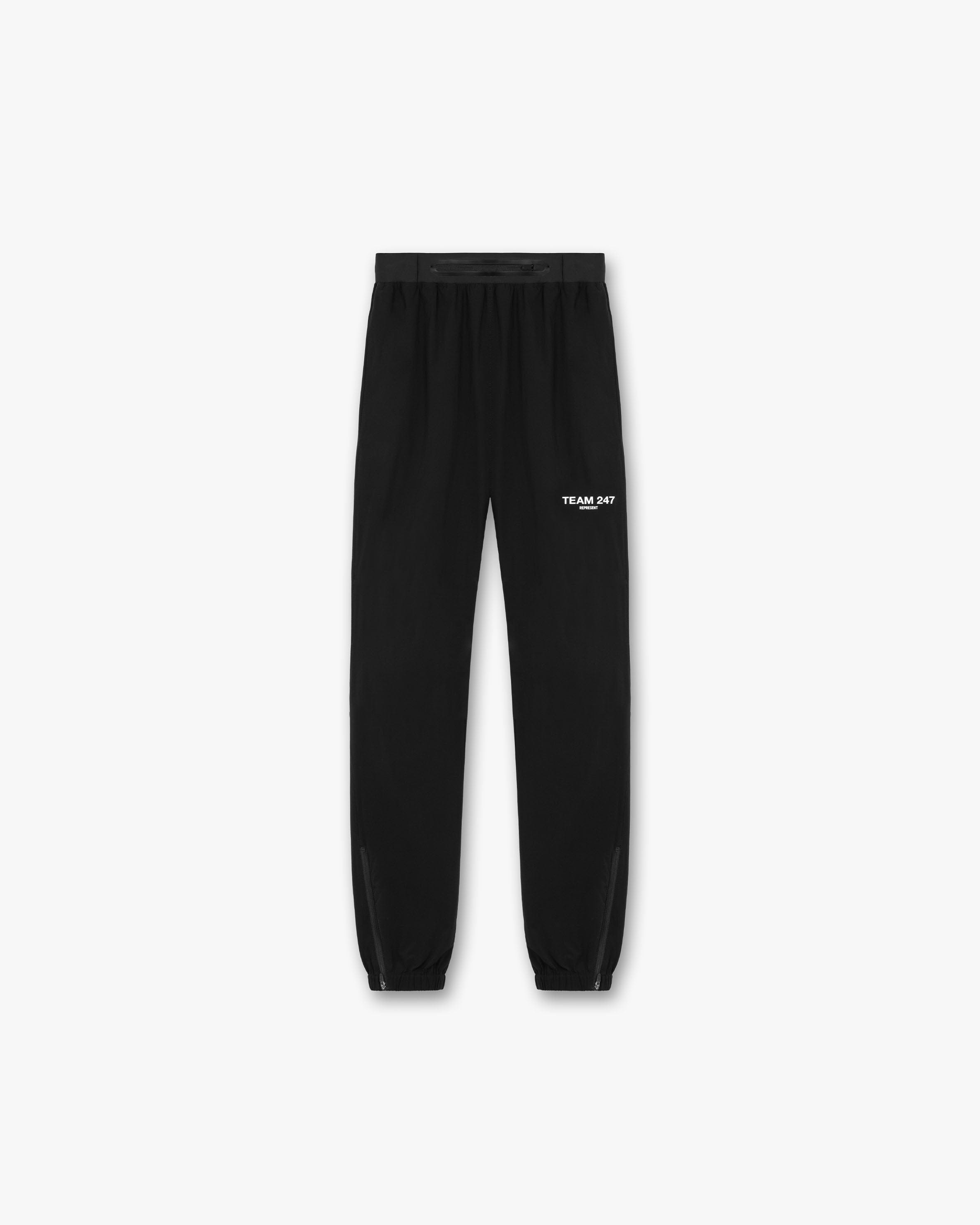 Back product image of mens black training pants on a plain white background | Team 247 Training Pant in Black | Training pants with elastic waistband and zip cuffs | 247 Pants | Represent Clo