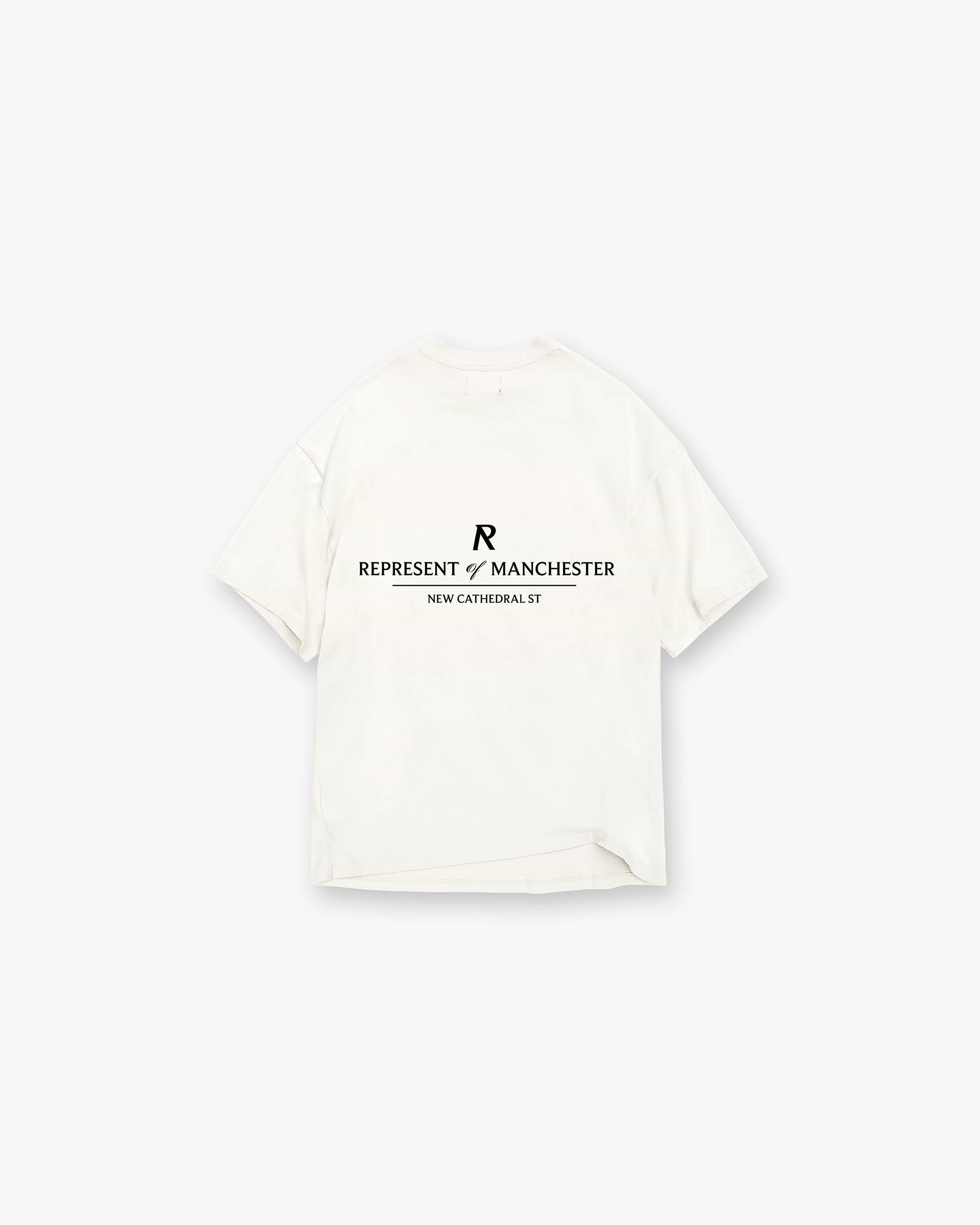 Back product image of a mens white t-shirt on a plain white background | Manchester Store T-Shirt in Flat White | Slightly oversized t-shirt with screen print | Exclusives T-Shirts | Represent Clo