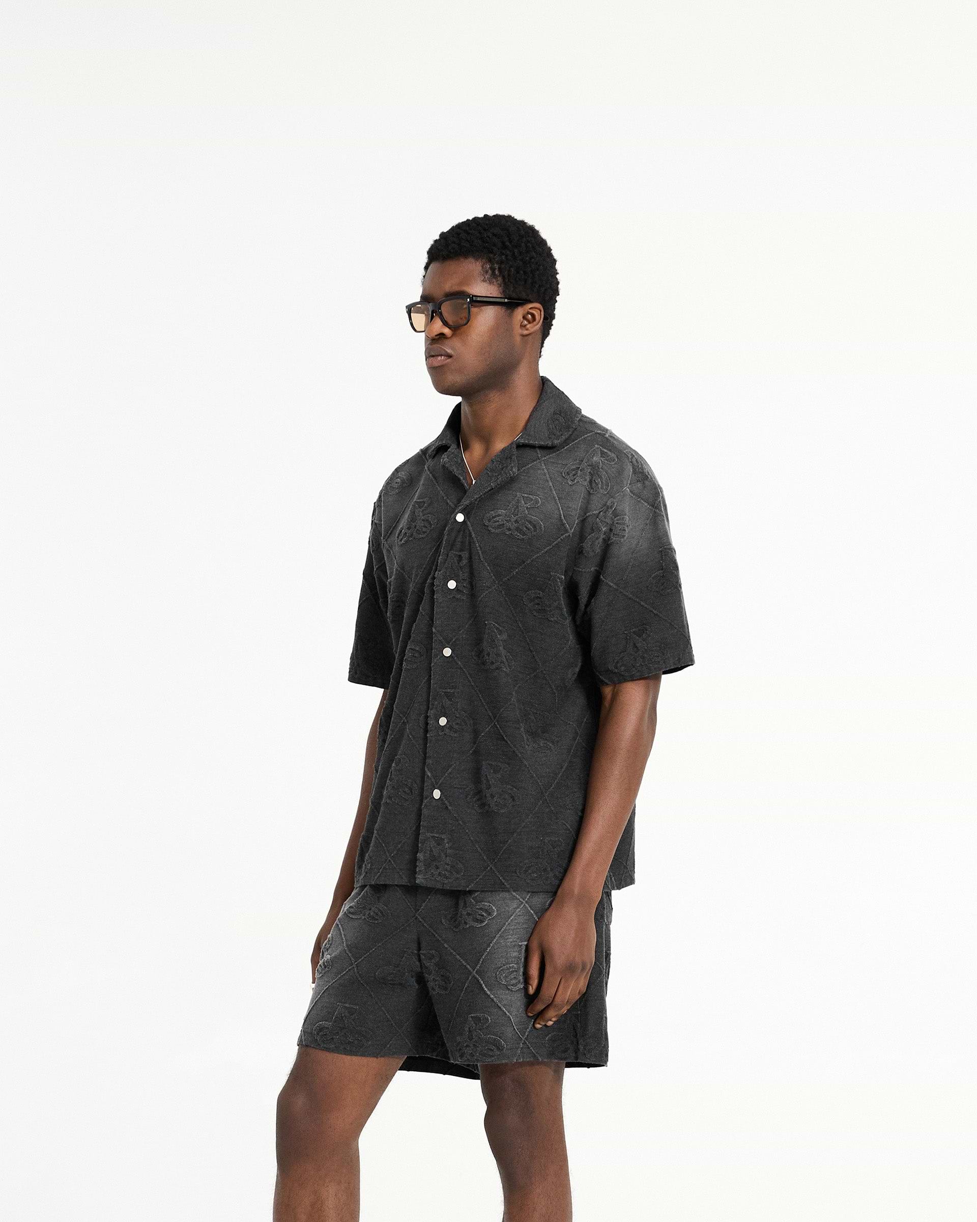 Back product image of a mens black shirt on a plain white background | Towelling Shirt in Jet Black | Oversized fit shirt with popper fastenings | SC24 Shirts | Represent Clo