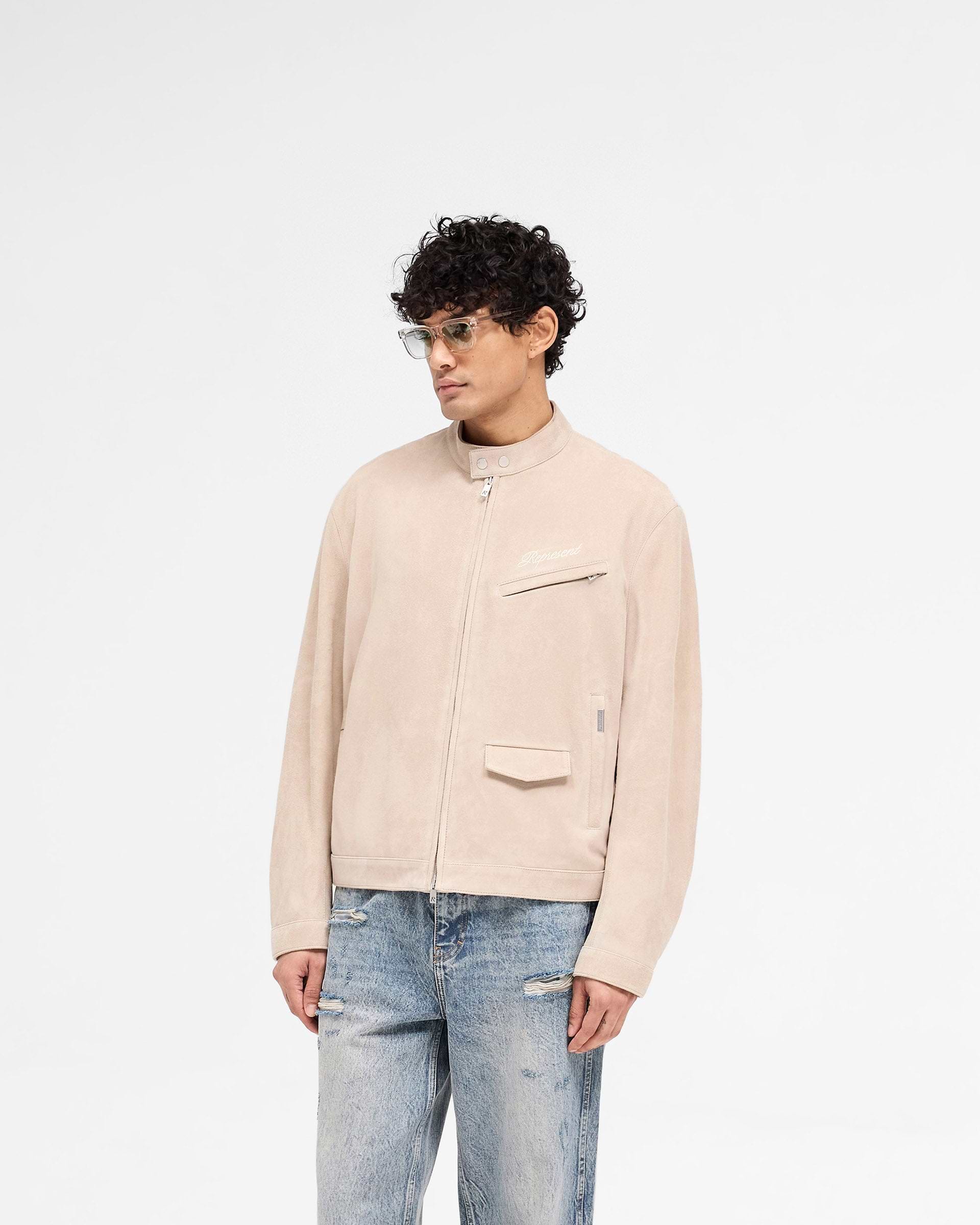 Back product image of a mens beige suede jacket on a plain white background | Overdrive Suede Jacket in Beige | Suede jacket with biker neck and vented shoulders | SS25 Outerwear | Represent Clo