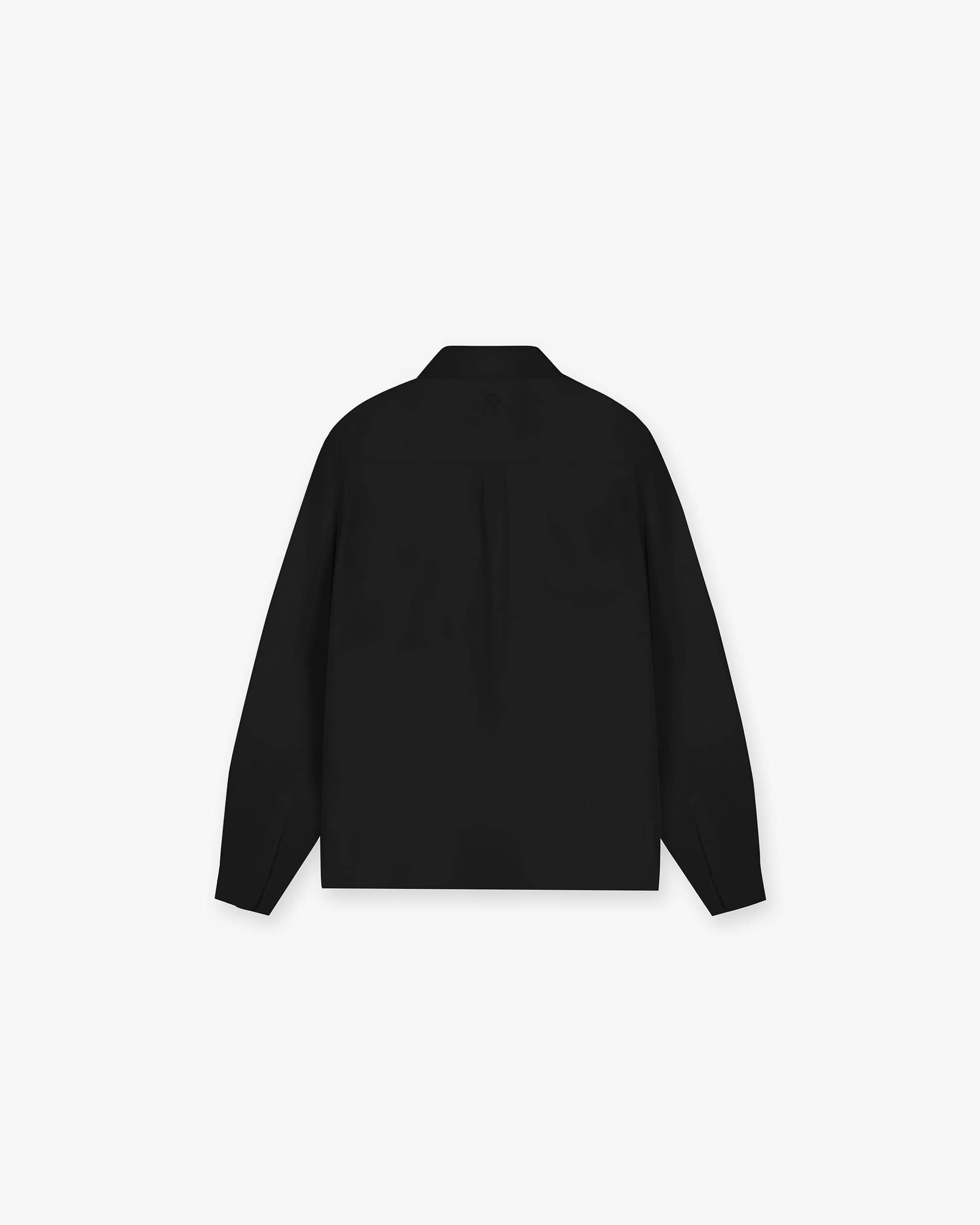 Back product image of a mens black shirt on a plain white background | Initial Shirt in Black | Drapey fabric oversized fit with chest pockets and concealed placket | Initial Shirts | Represent Clo