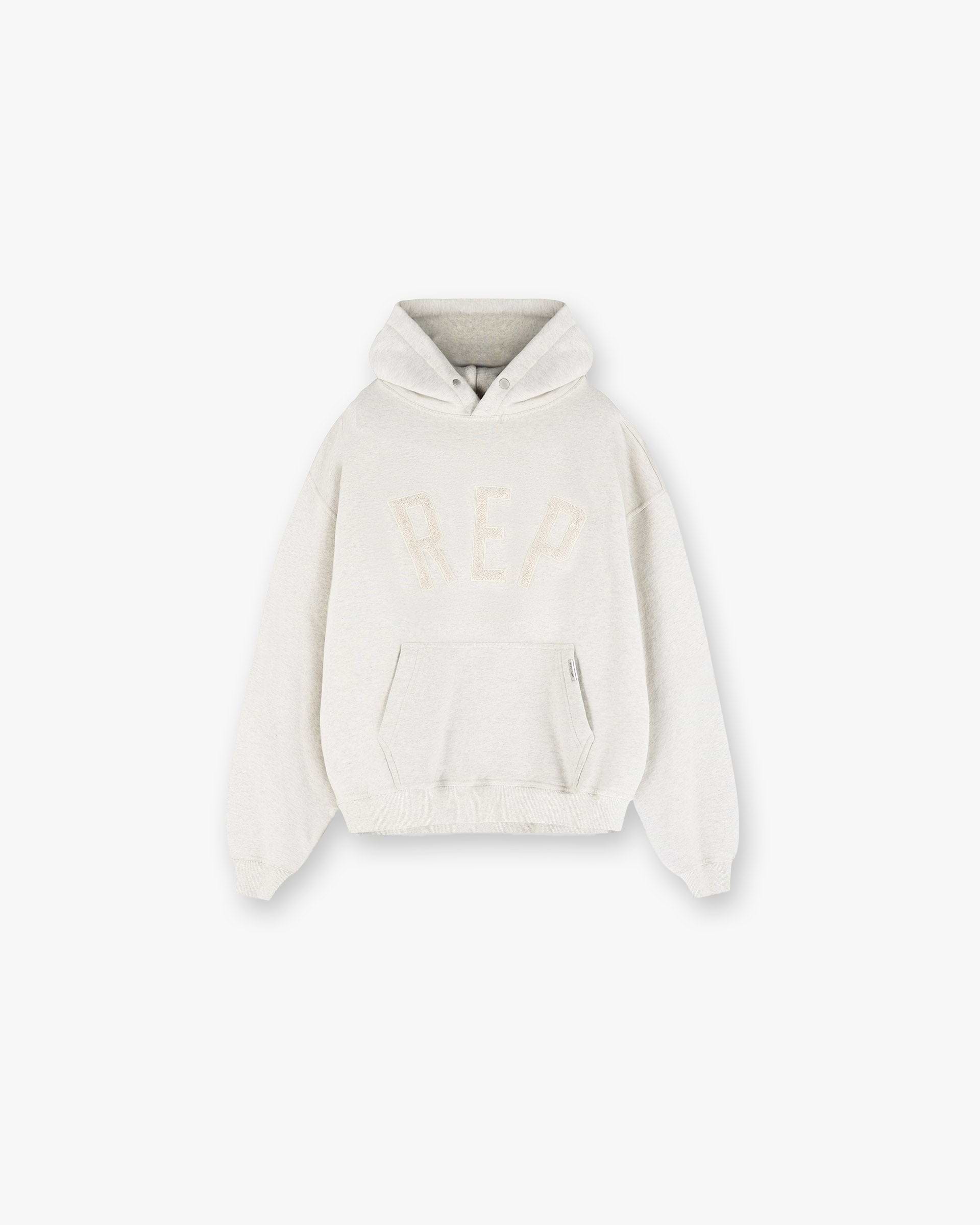 Front product image of a mens cream hoodie on a plain white background | Rep Applique Hoodie in Cream Marl | Cotton Hoodie | SS25 Hoodies | Represent Clo