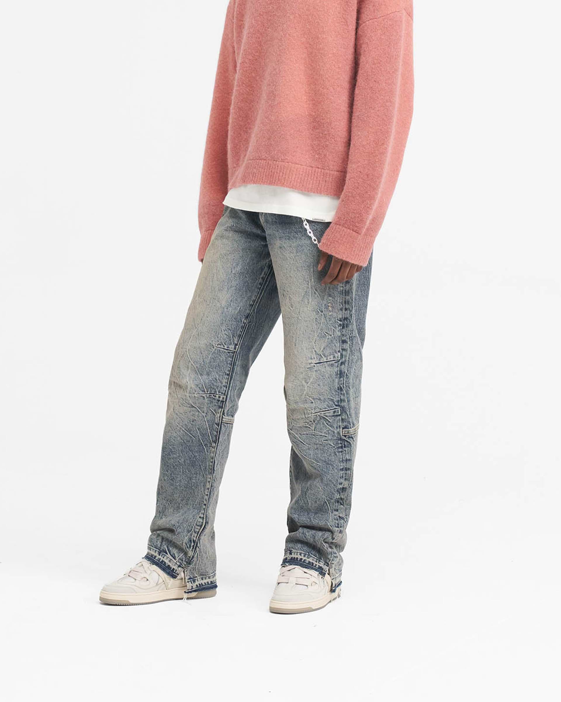 Back product image of mens blue denim jeans on a plain white background | R2 Stepped Hem Denim in Mid Blue | Jeans with stepped hem and whiskering details | SS24 Denim | Represent Clo